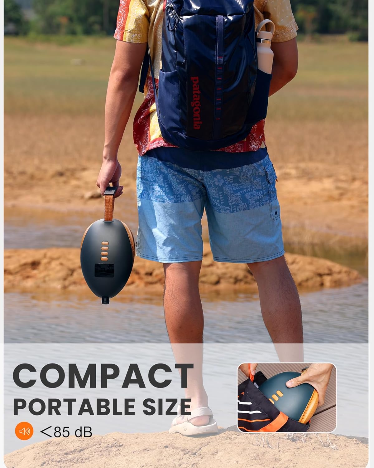OutdoorMaster Dolphin Electric SUP Pump being carried, emphasizing its compact and portable size.