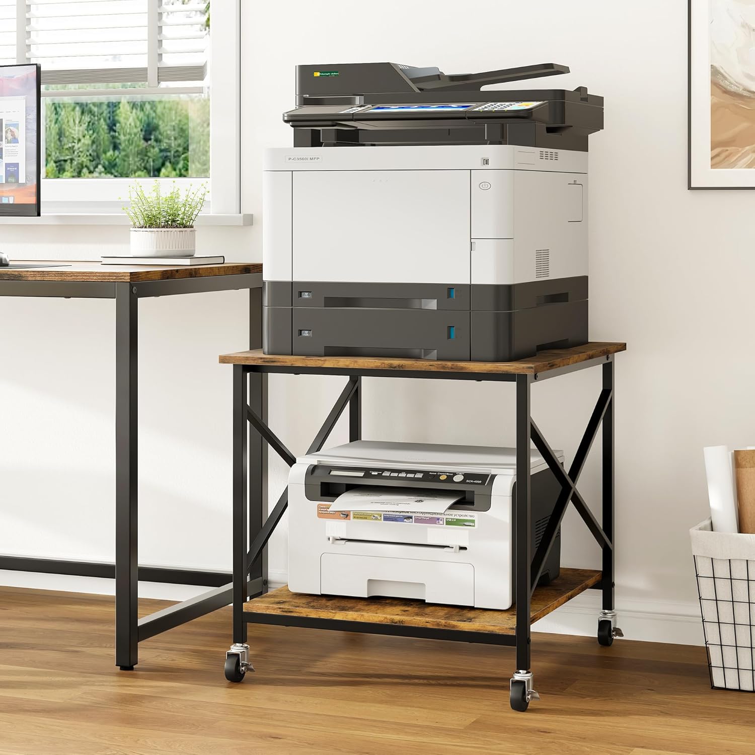 Printer stand with a large printer on top and paper on the bottom shelf in an office setting