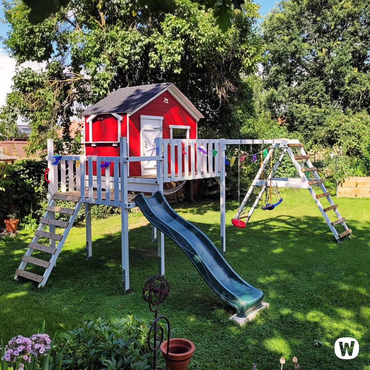 WICKEY Spielturm Klettergerüst Smart Ocean mit Schaukel & grüner Rutsche, Outdoor Kinder Kletterturm mit Sandkasten, Leiter & Spiel-Zubehör für den Garten