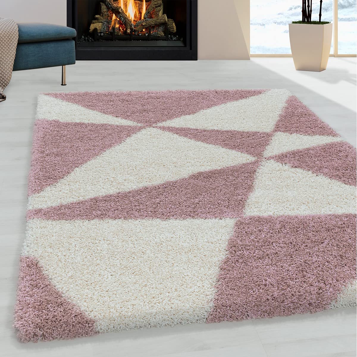 Tapis rose rond 160 cm de salon avec design géométrique moderne