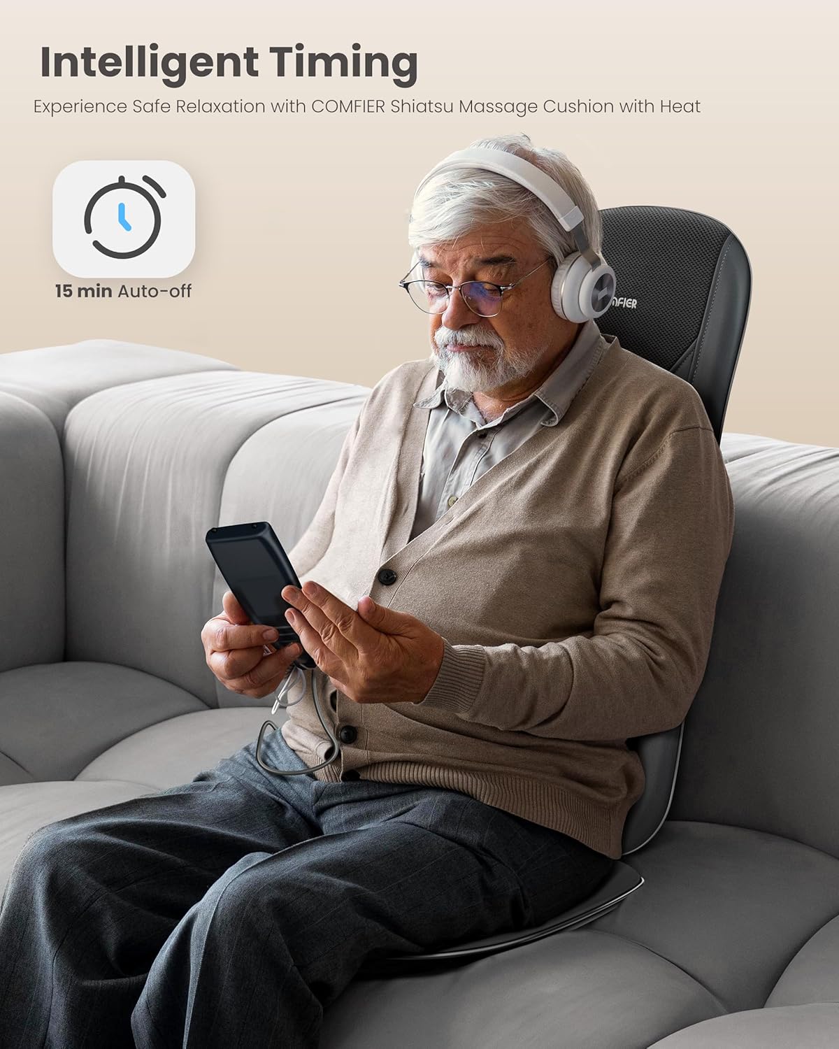 Man using the COMFIER Back Massager with heat, focusing on a specific spot on his back, demonstrating the SPOT massage function for precise relaxation.