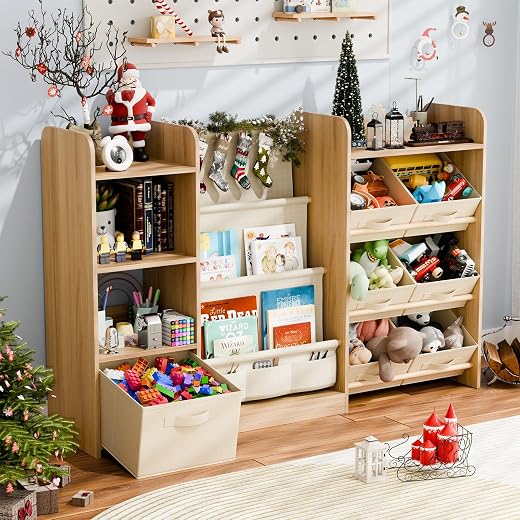 Large wooden children’s organizer with open toy bins, front-facing book shelves, books, stuffed animals, blocks, dolls, and holiday decorations in a playroom.