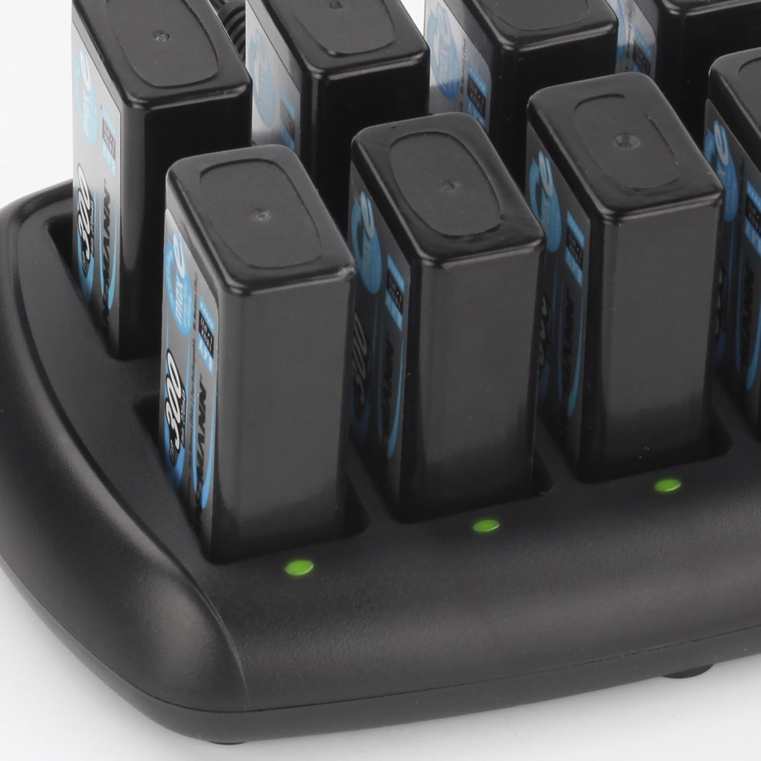 Close-up of Ansmann 10-Bay 9V Battery Charger showing green LED indicators for charged batteries