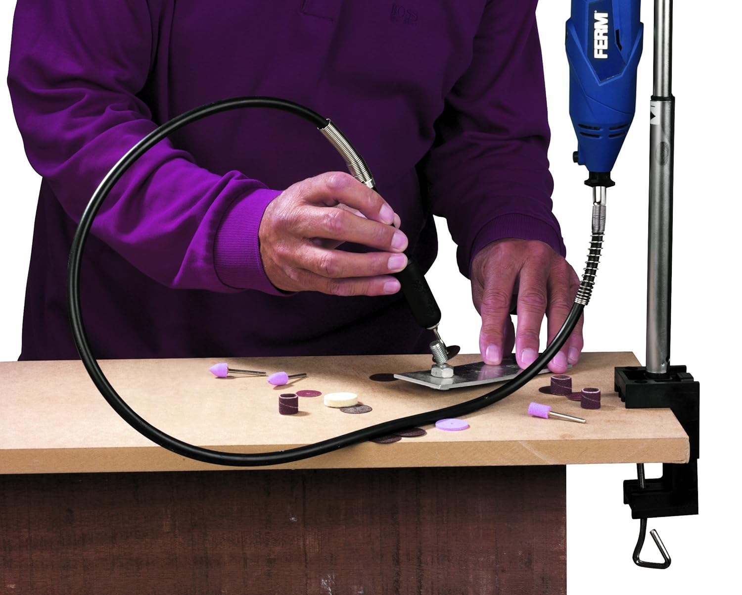 User operating the FERM CTM1017 Combi Tool with flexible shaft on a workpiece