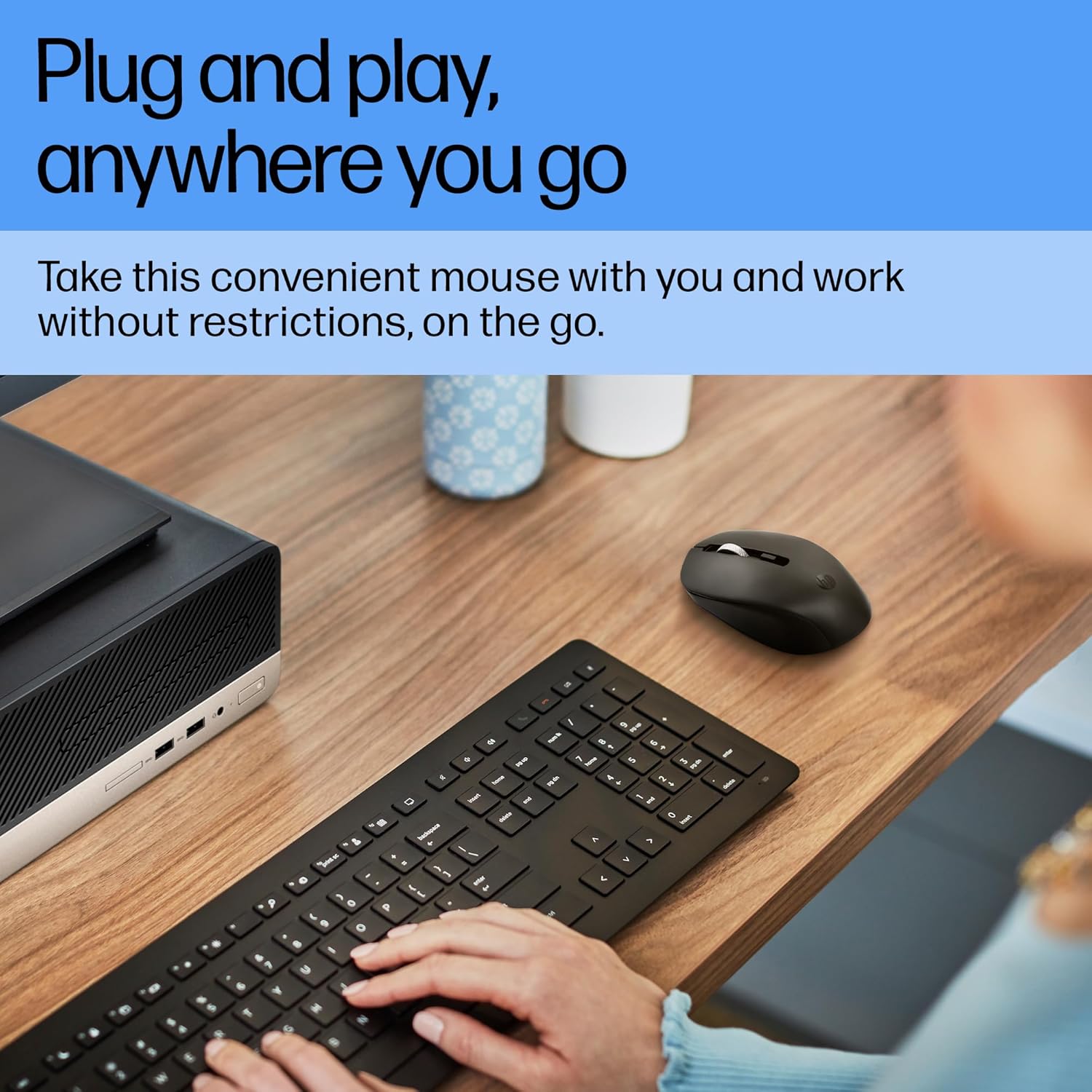 Person using HP S1000 Wireless Mouse with a laptop and keyboard