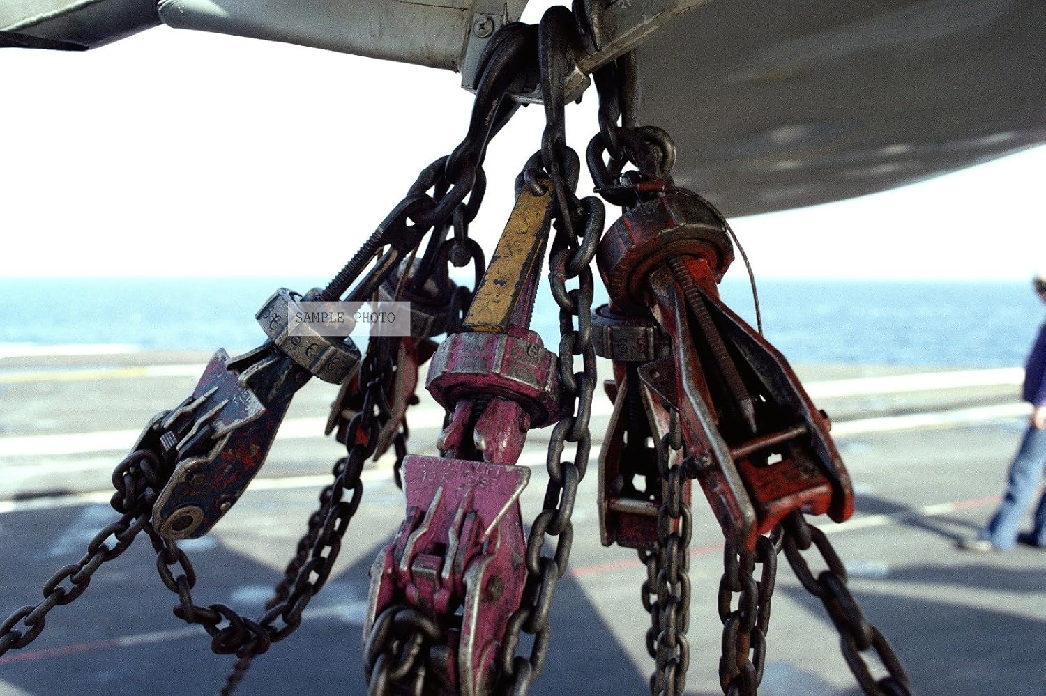 Photo Tie down chains are used to secure an aircraft to the