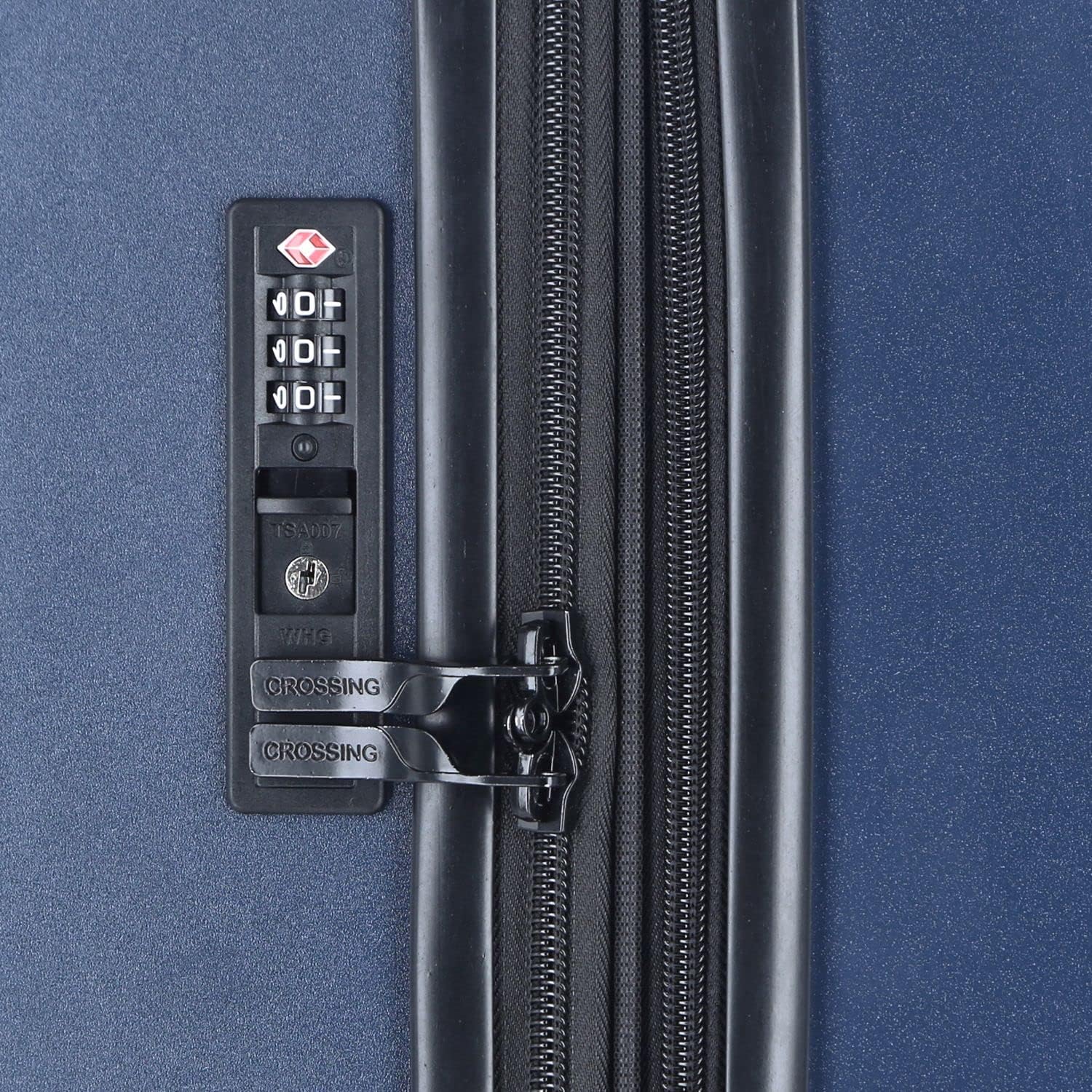 Close-up of the TSA combination lock on the side of the luggage, showing the three-digit dials and the lock mechanism.