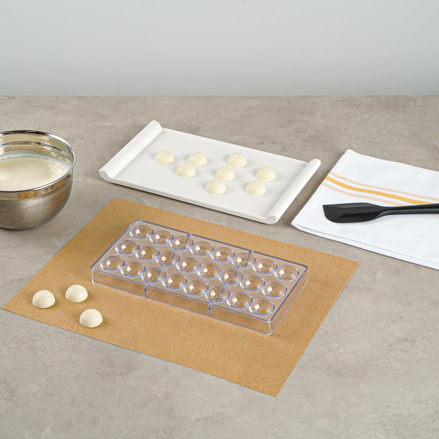 Restaurantware Pastry Tek 10.8 x 5.3 Inch Chocolate Shaping Mold 1 Freezable Candy Mold - 24 Cavities Soccer Ball-Shaped Clear Polycarbonate Chocolate Mold Dishwashable Easy To Release