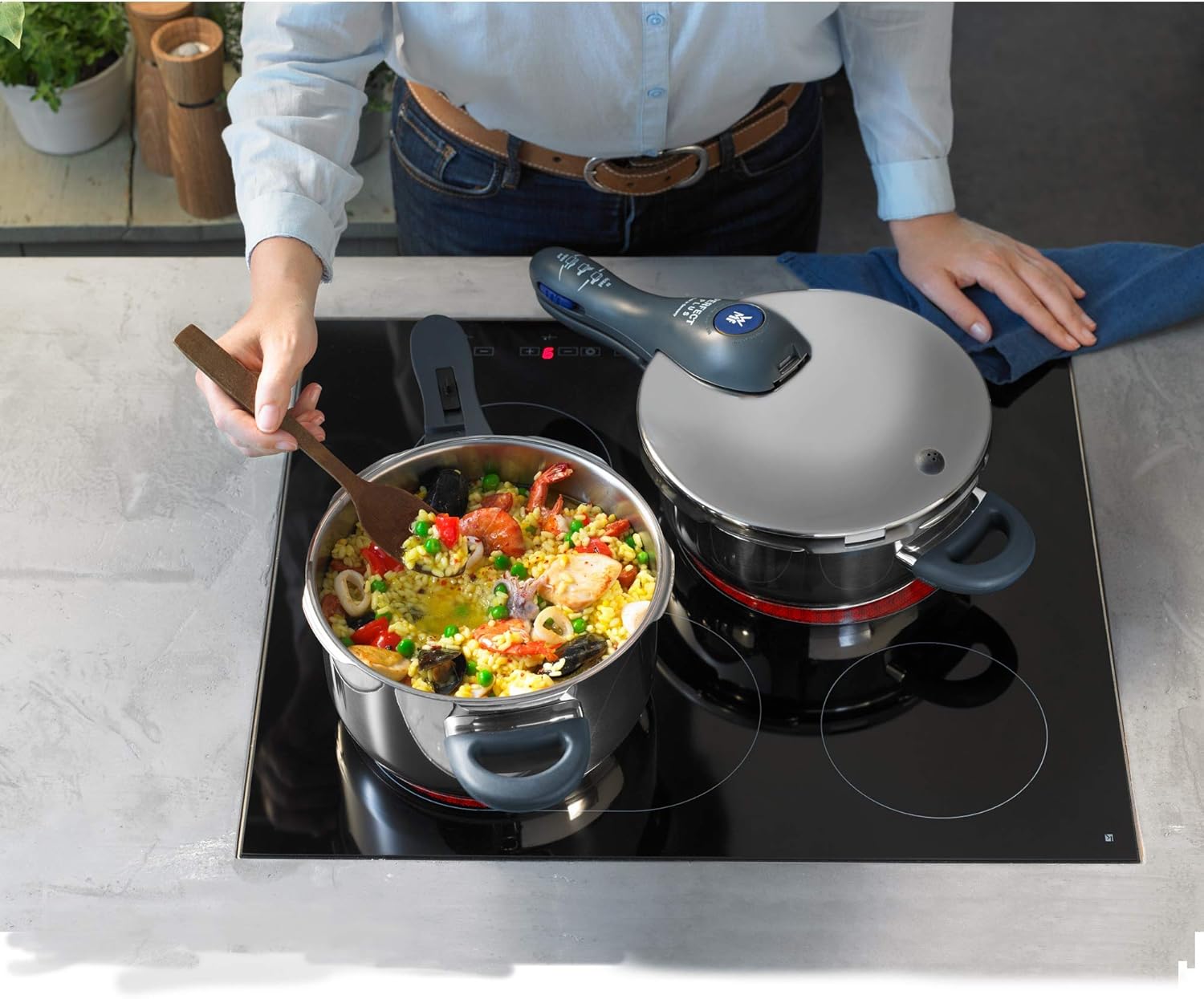 WMF Perfect Plus Pressure Cooker in use on an induction hob