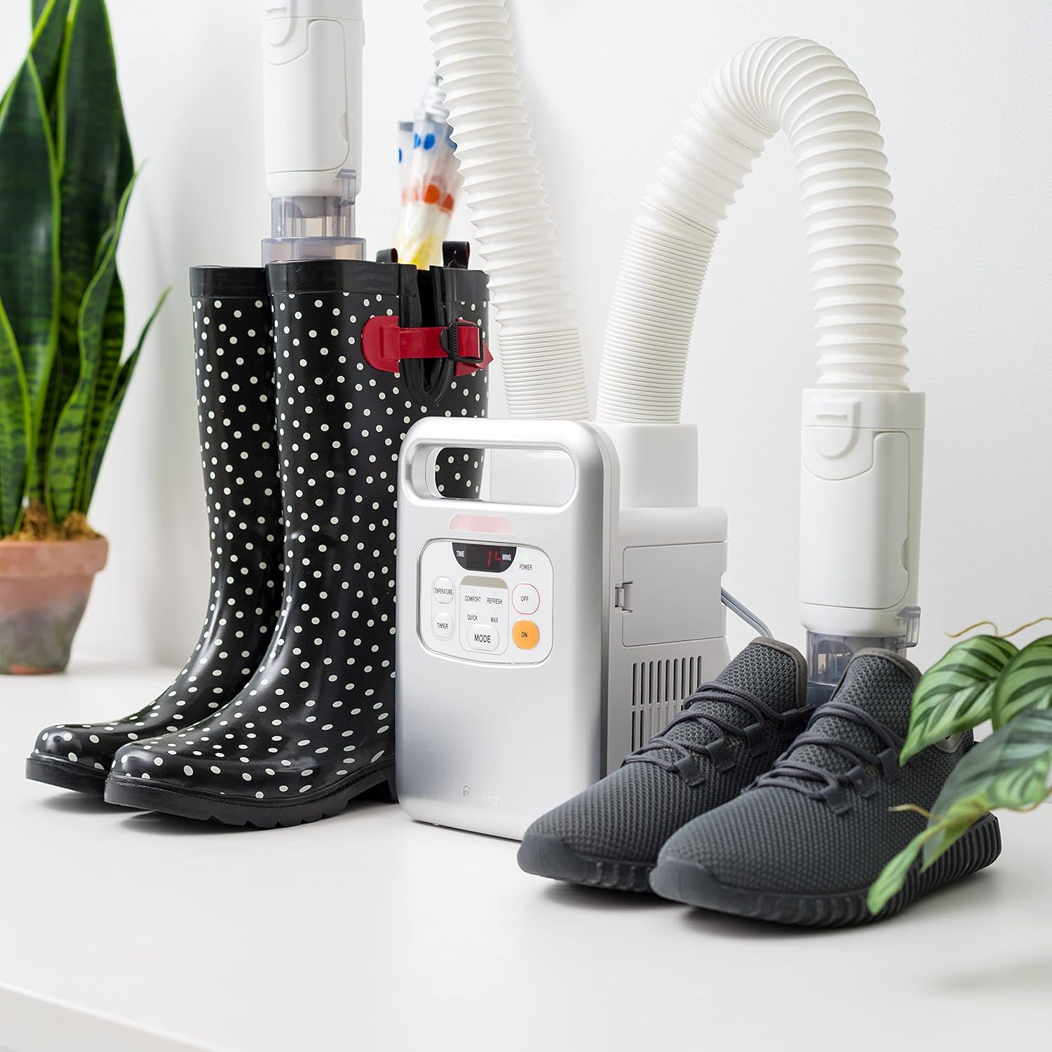 IRIS USA BLW-C2 Blanket Warmer drying rain boots and sneakers using the shoe dryer attachments.