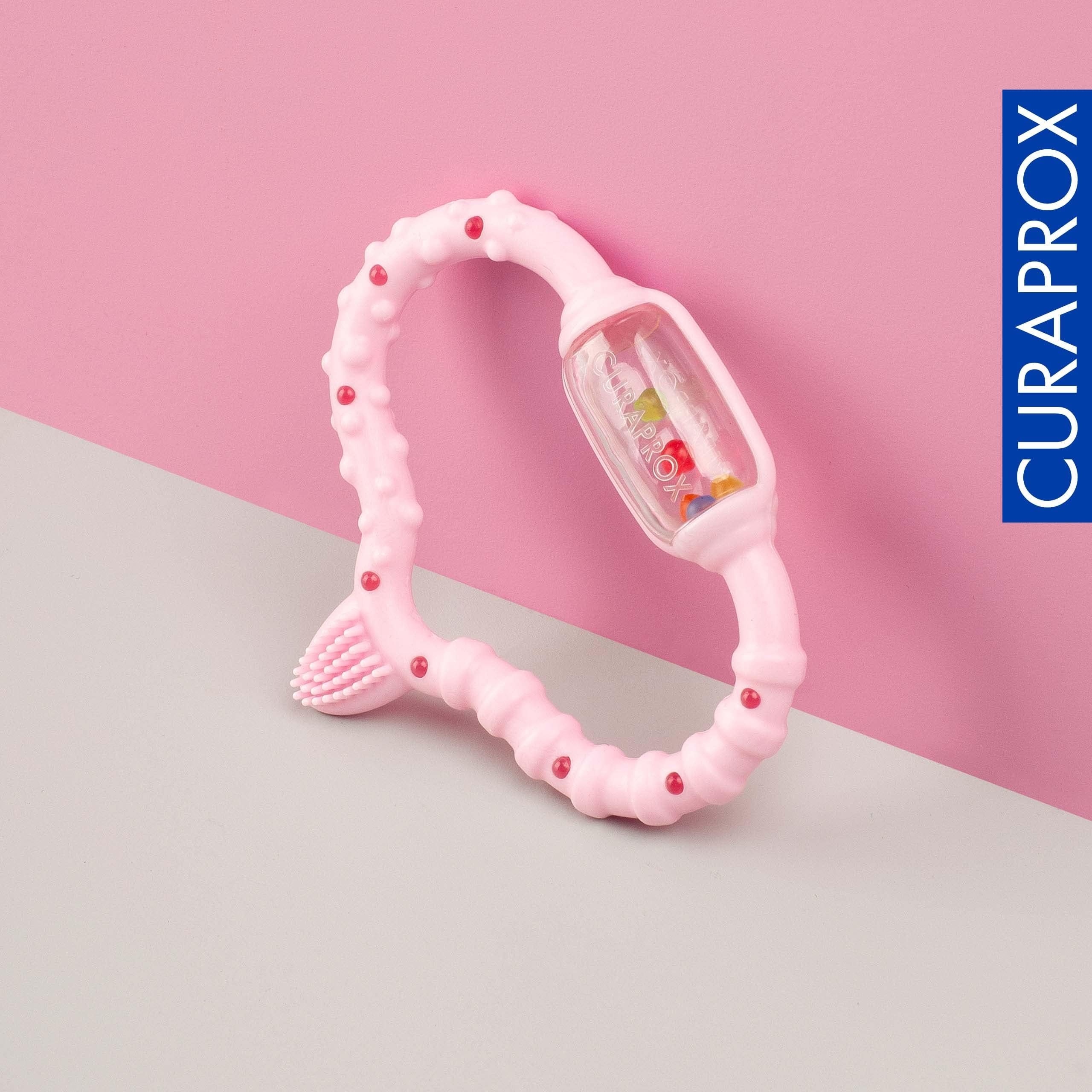 Curaprox Baby Dentizione Anello-Per neonati 0-24 mesi/Lenisce dentizione disagio e incoraggia le capacità motorie/BPA-Free, Rosa, con la formazione spazzolino da denti | Made in Switzerland