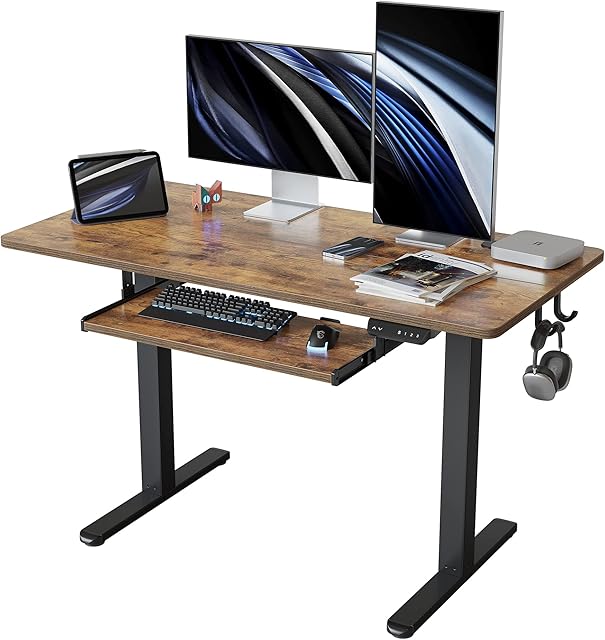 FEZIBO Height Adjustable Electric Standing Desk with Keyboard Tray, 120 x 60 cm Sit Stand up Desk with Splice Board, Black Frame/Rustic Brown Top