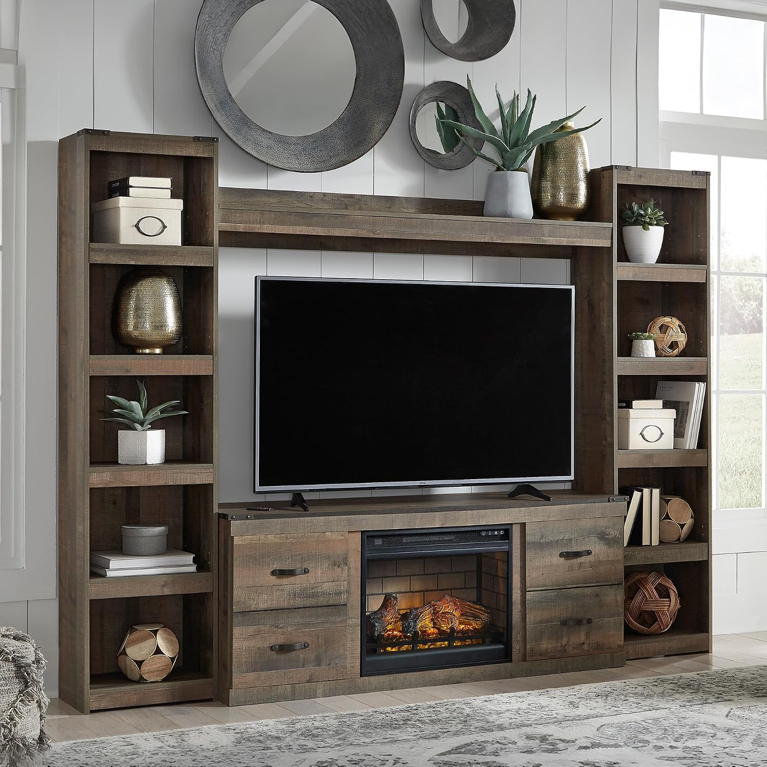 Signature Design by Ashley Trinell Rustic 4-Piece Entertainment Center with Electric Fireplace for TVs up to 69", Light Brown