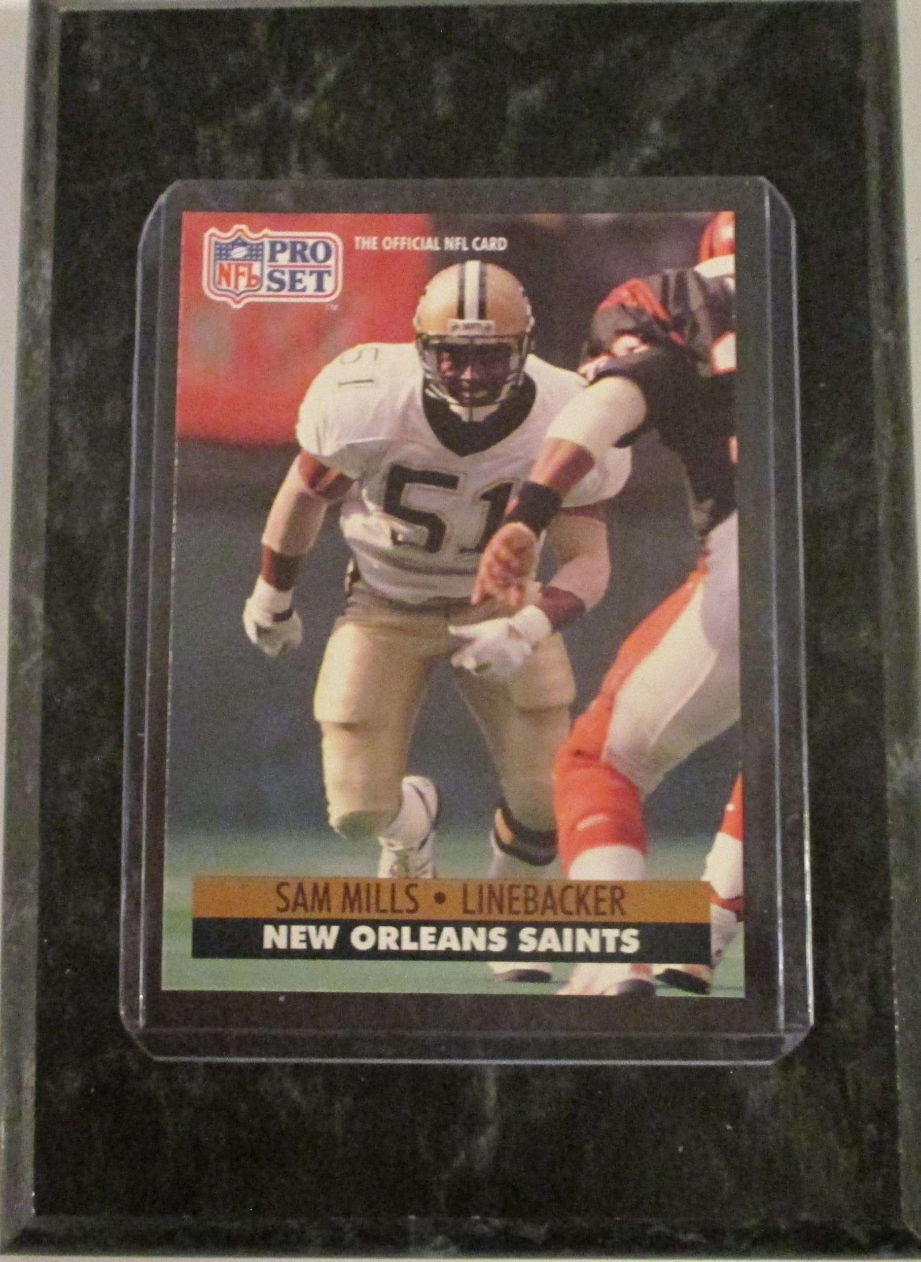 SAM MILLS NEW ORLEANS 1991 PRO SET FOOTBALL PALYER CARD MOUNTED ON A '4 X "6 BLACK MARBLE PLAQUE