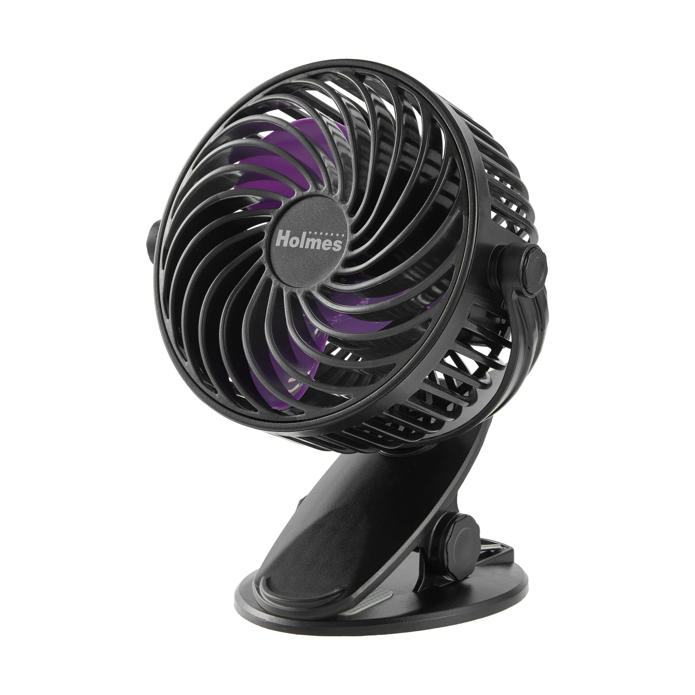 Holmes 4-inch On-The-Go Personal Fan with Clip, showing its compact size and purple blades.