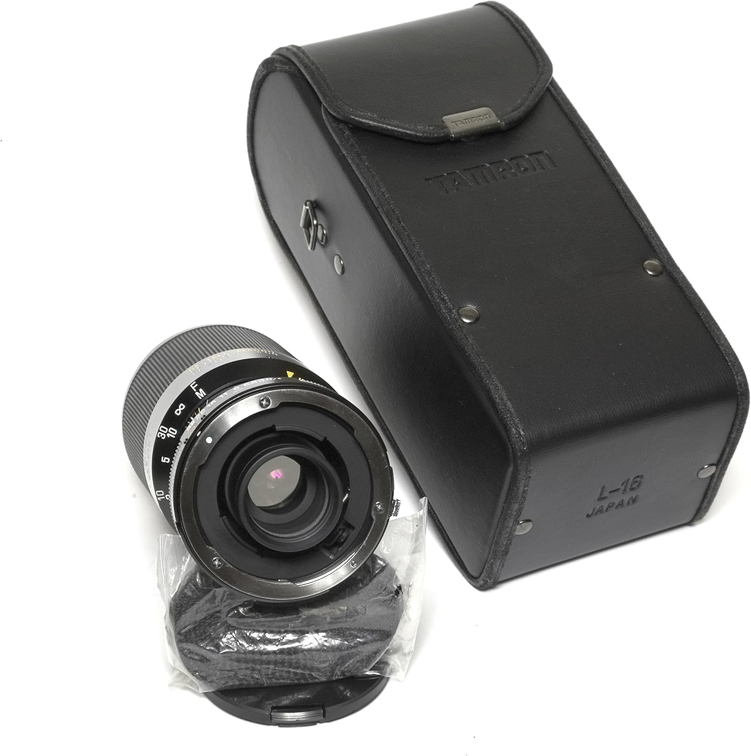 belakang view of Tamron 80-210mm lens with Adaptall 2 mount attached, next to its carrying case and lens cap.