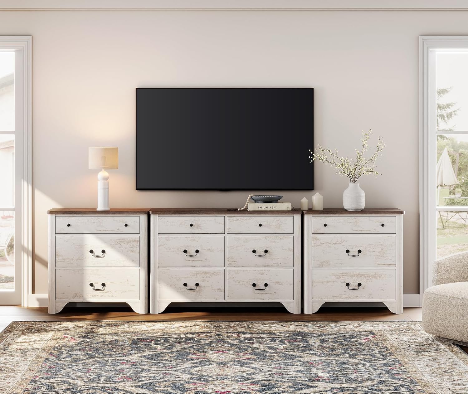 Fully assembled WAMPAT White Dresser TV Stand with a television mounted above it, showcasing the combined unit in a living room setting.
