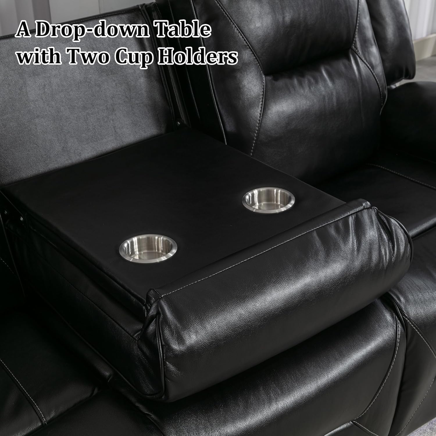 Close-up of the center console with the drop-down table and two cup holders.