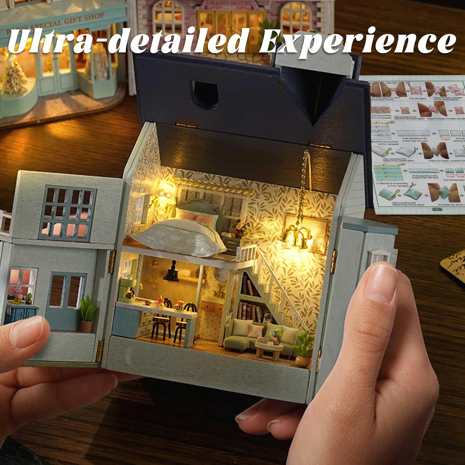 Hands assembling miniature furniture inside the Flever Warm House dollhouse