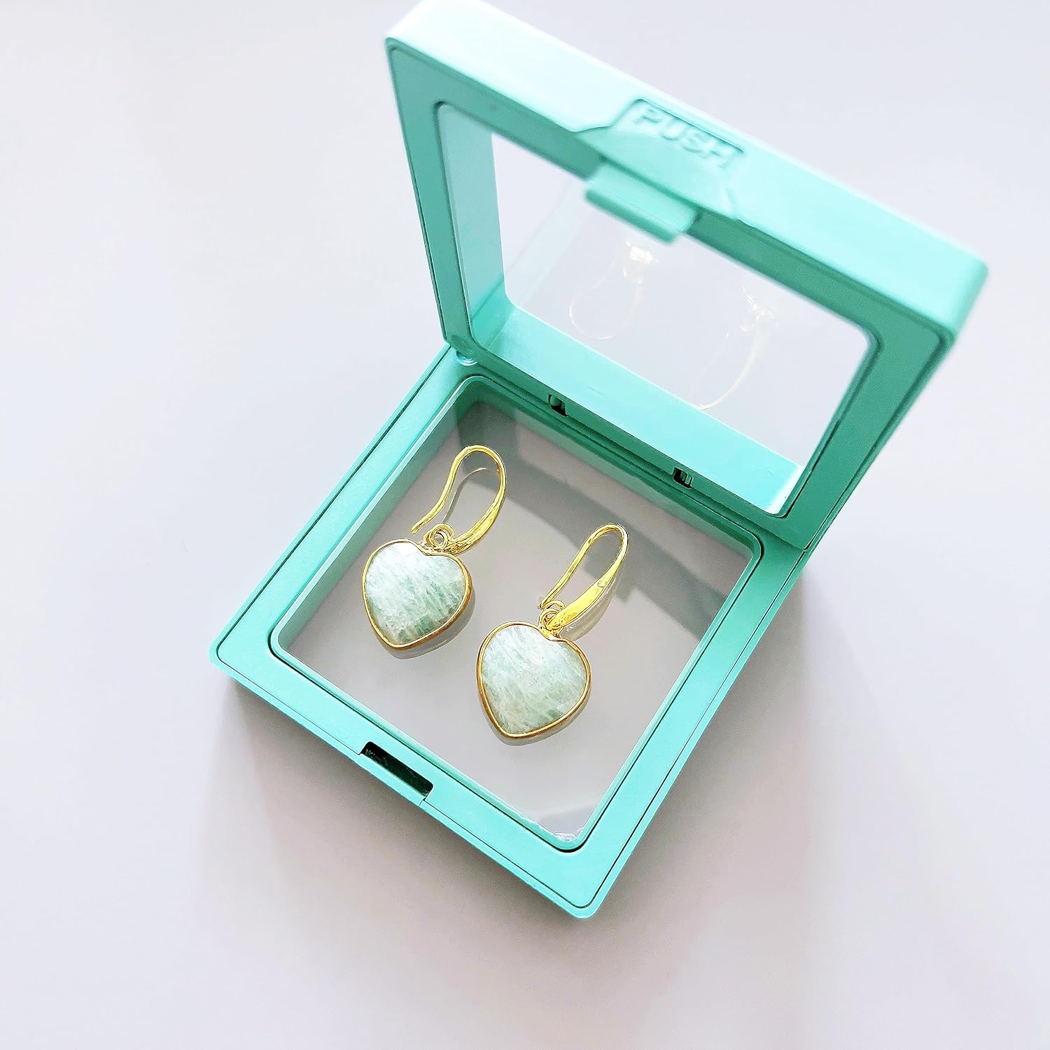 BOSUDA Peach Heart Dangle Earrings stored in a teal jewelry box