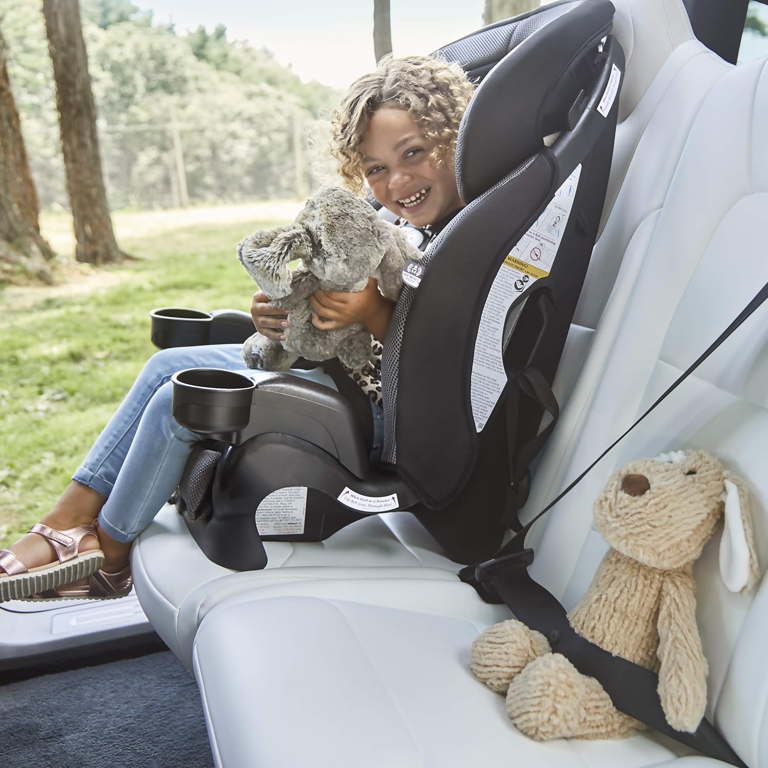 Child happily seated in the Evenflo Chase Plus car seat