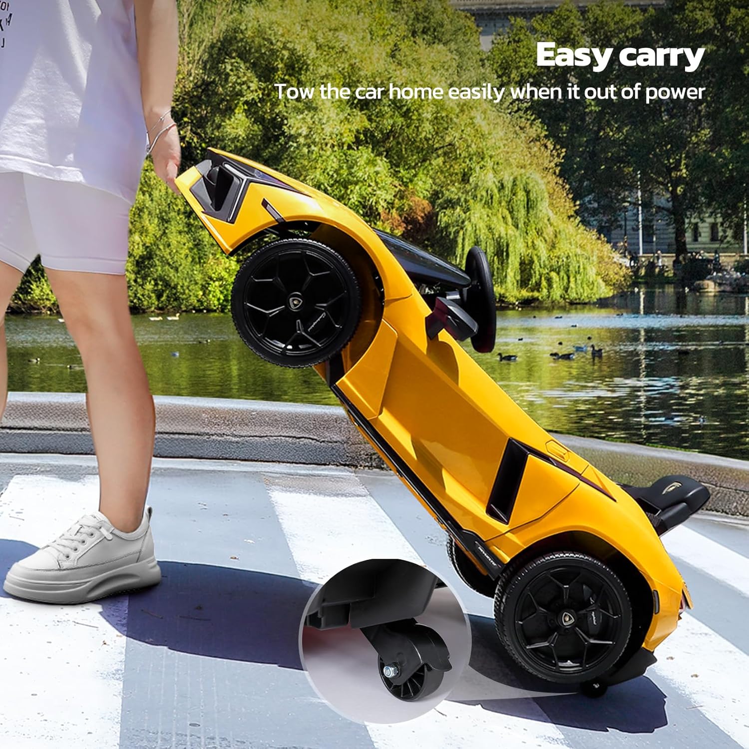 Person towing the ride-on car using its rear wheels, demonstrating the easy carry feature