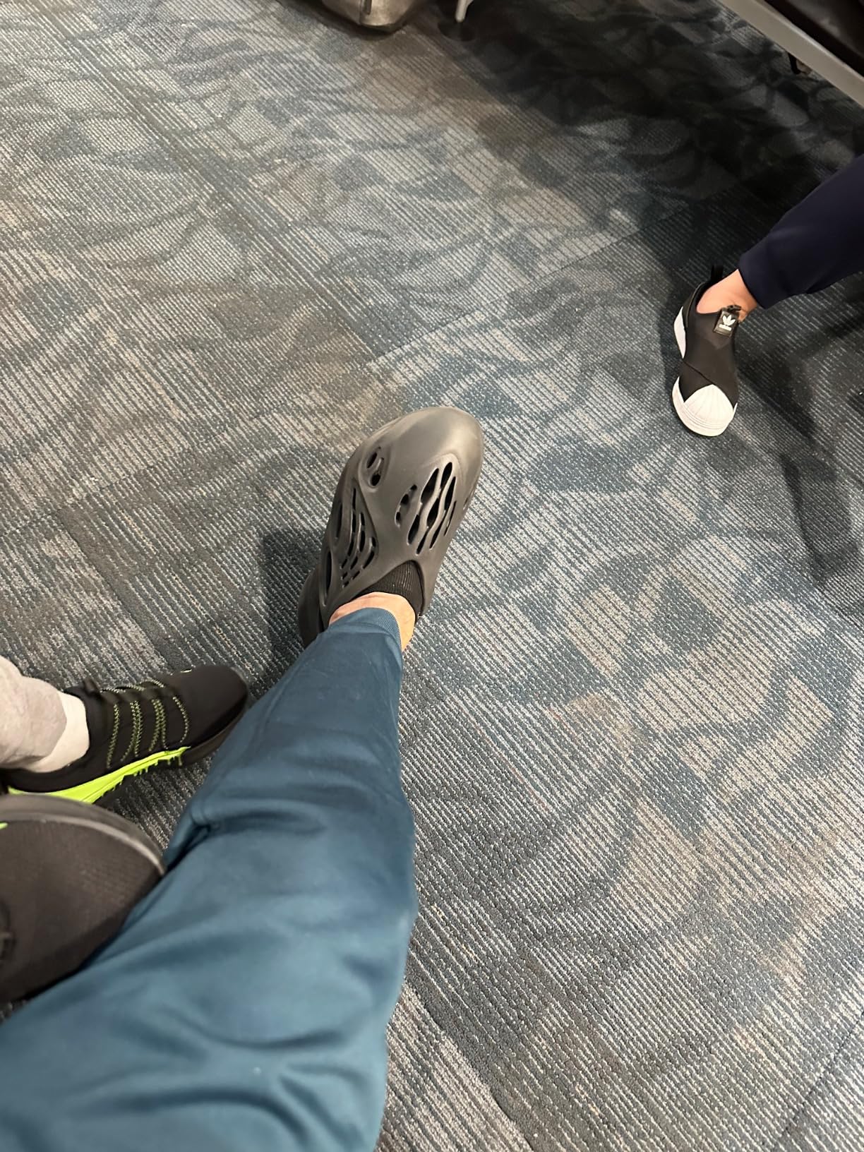 black yeezy foam runner on feet