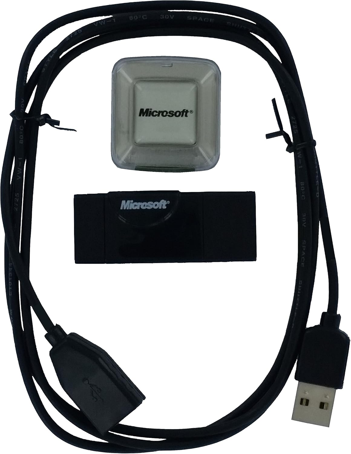 Contents of the Microsoft Pharos GPS-500 III package, showing the GPS receiver, a clear protective case, and a USB cable.