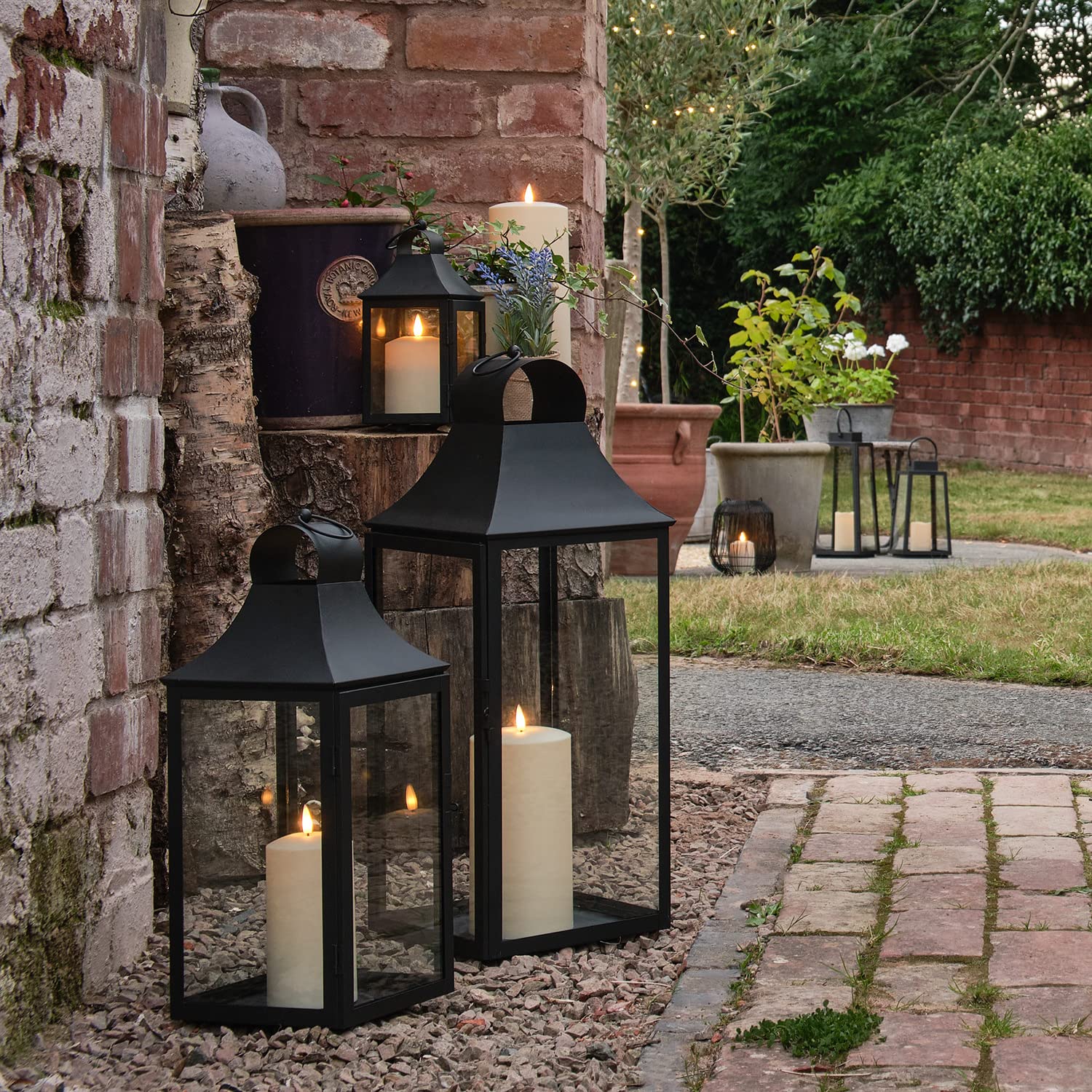 Lights4fun Set of 3 Outdoor Garden Classic Black Metal Decorative Lanterns with TruGlowยฎ LED Candles Battery Operated with Timer
