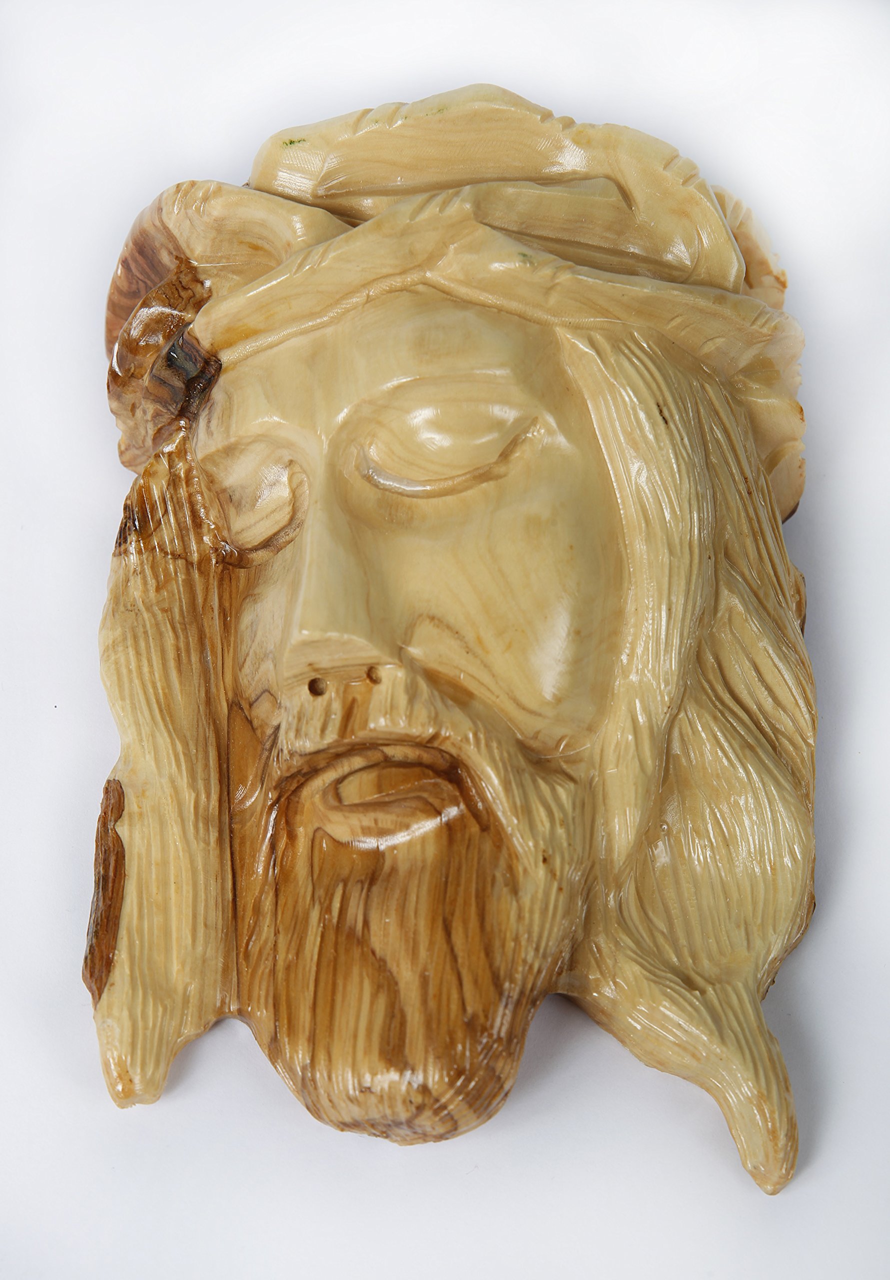 Our Lord & Savior Jesus Christ's Face Carved Out Of A Solid Piece Of Olive Wood (wall decoration). This Solid Olive Wood Piece was hand crafted by Artisans in Bethlehem (the birth place of Jesus). An Ideal Religious Gift for Christmas!