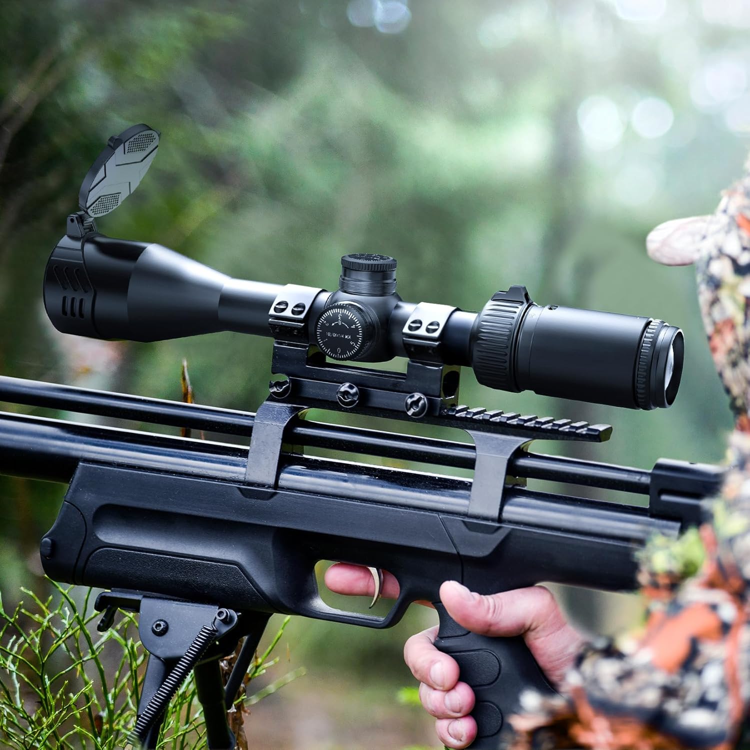 Person holding a rifle with the RioRand scope mounted, aiming