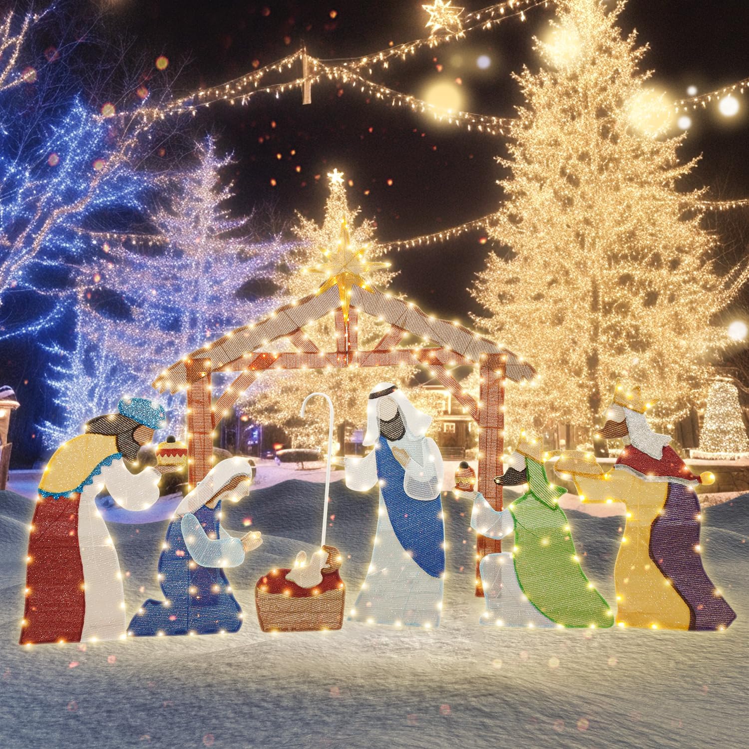 Assembled morabloomy 5FT Lighted Outdoor Nativity Set displayed in a snowy outdoor setting at night, illuminated with warm white LED lights.