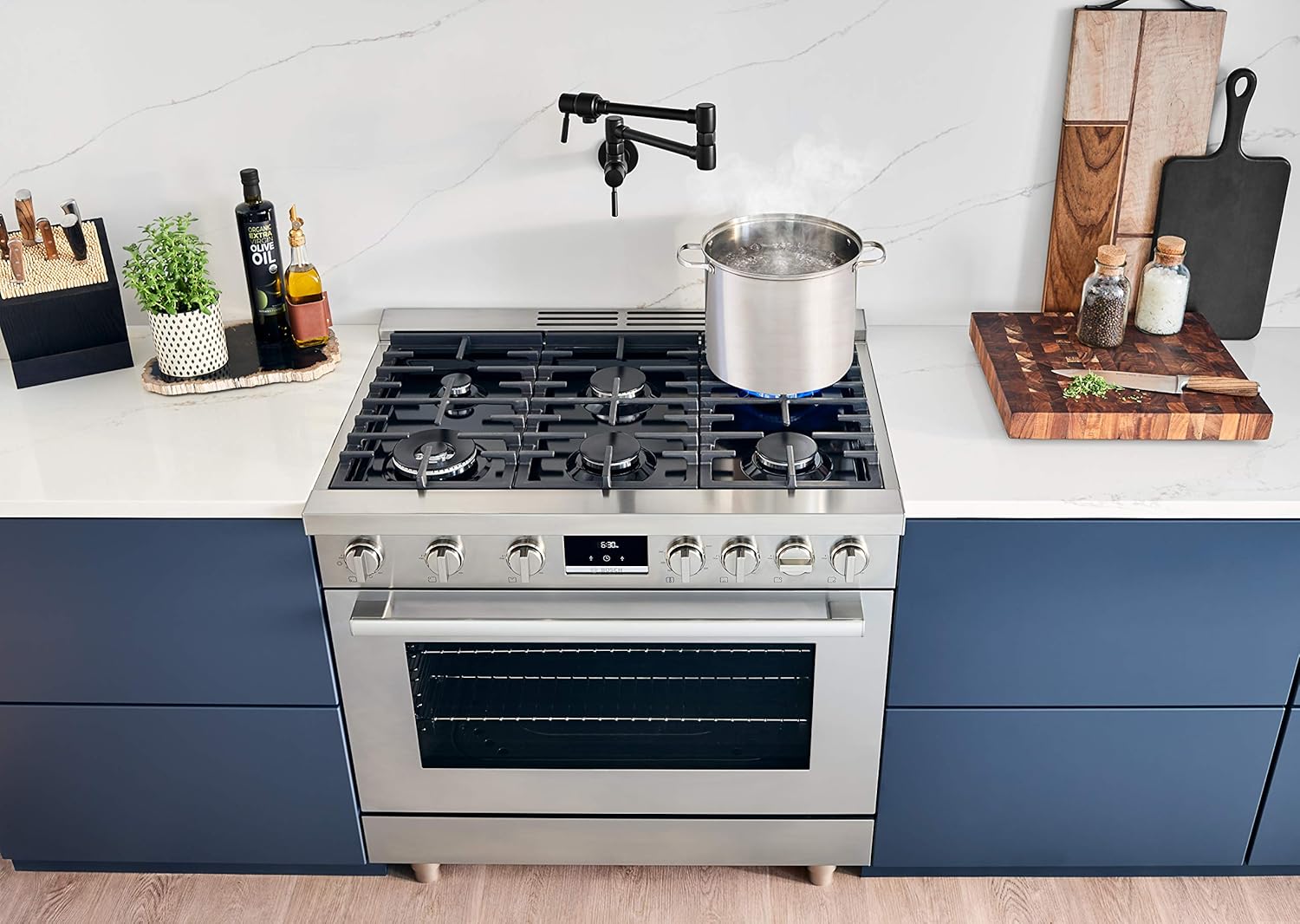 Bosch 800 Series Gas Range cooktop with a pot boiling on a lit burner.
