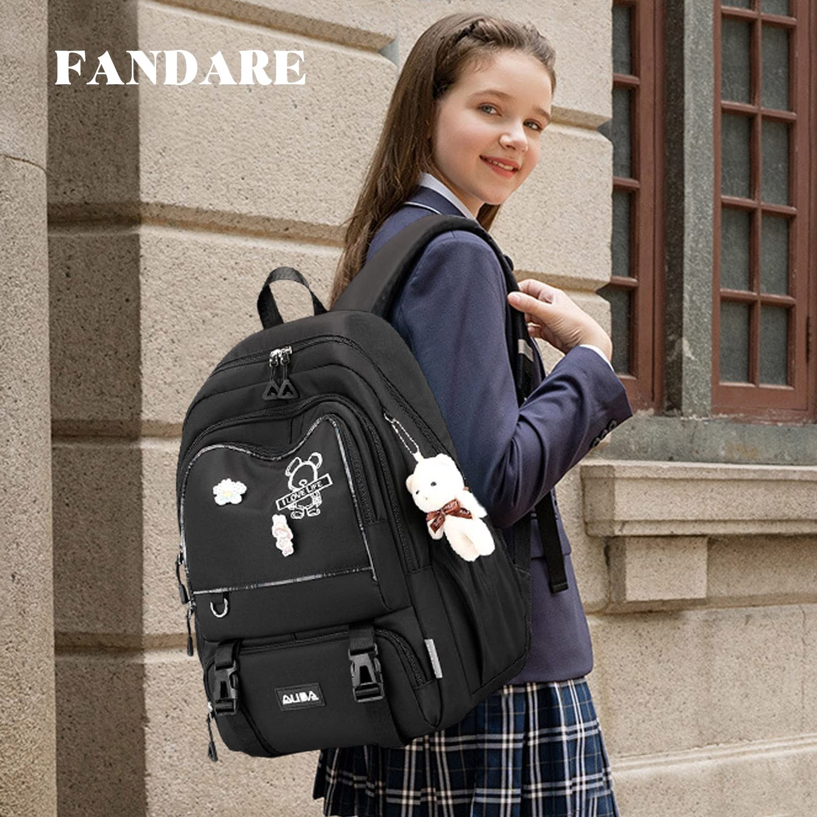 FANDARE Zainetti Cartelle per Scuola Elementare, Zaino Casual per Ragazzi Studenti Scuole primarie Viaggiare, Daypacks con ciondolo in peluche, Impermeabile, Nylon Nero