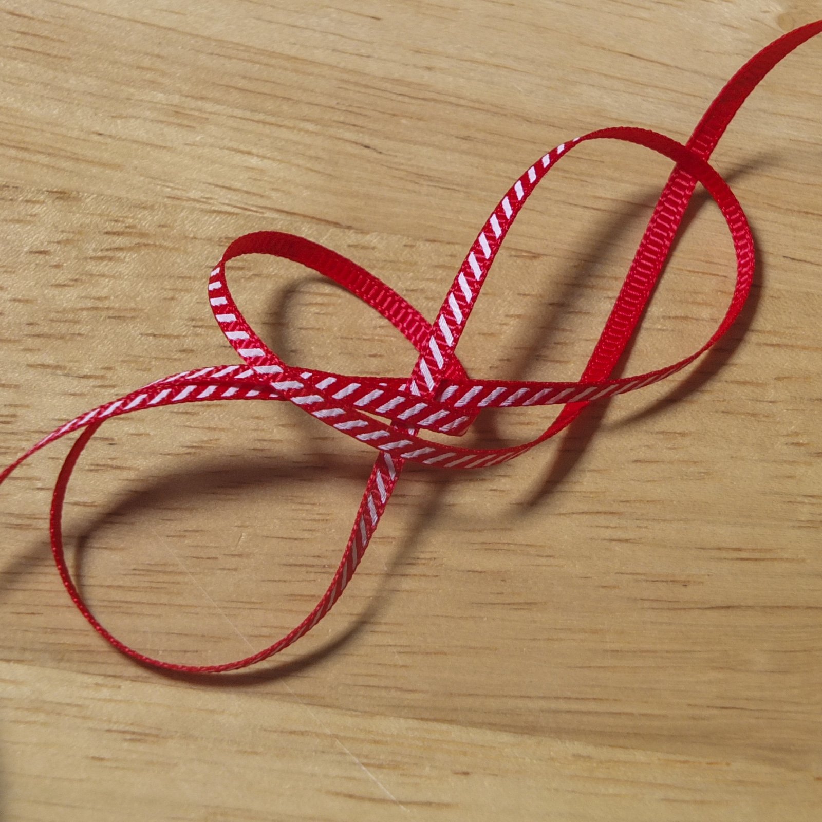 2 metres of Candy Cane Stripe Christmas Grosgrain Ribbon - red with a white diagonal stripe (3mm)