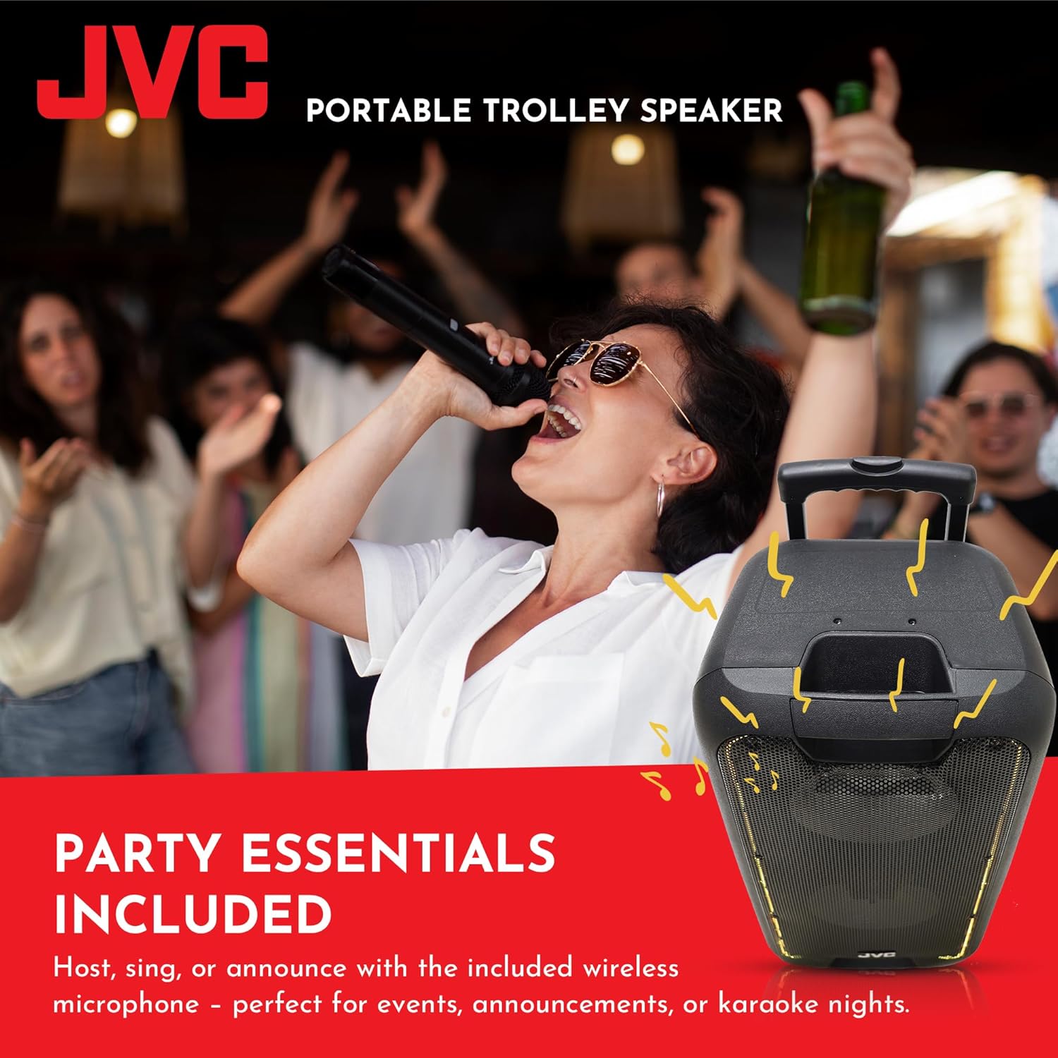 Person singing into a wireless microphone with the JVC trolley speaker in the foreground