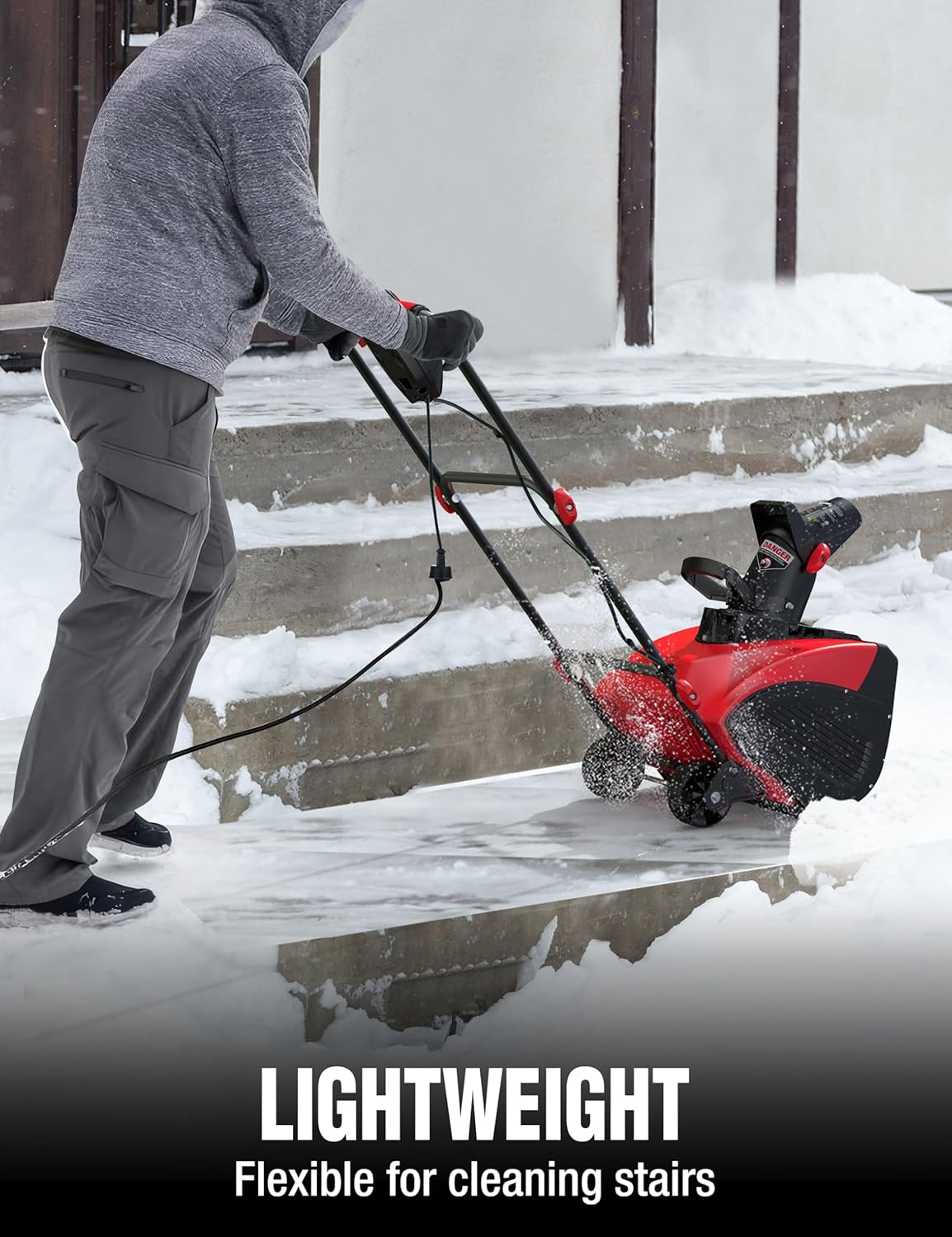 Person using PowerSmart snow blower to clear snow from outdoor stairs.