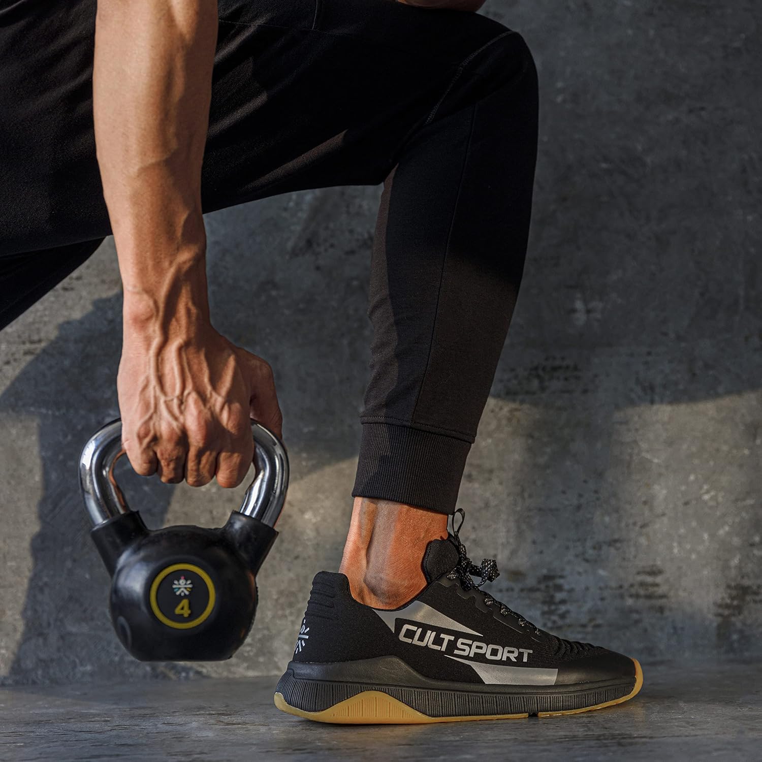 Person performing a kettlebell exercise while wearing CULTSPORT X1 Training Shoes