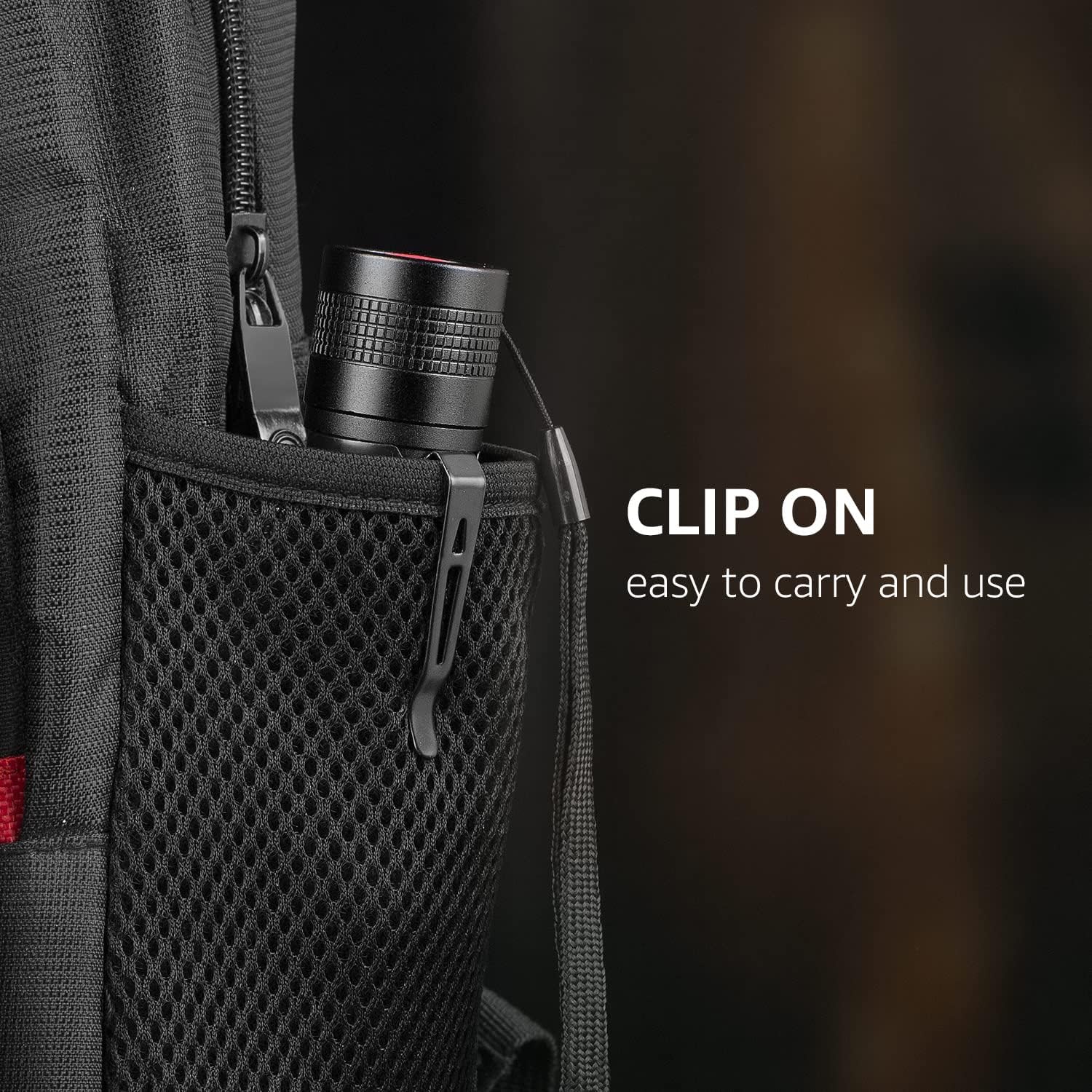 Flashlight clipped to a backpack mesh pocket.