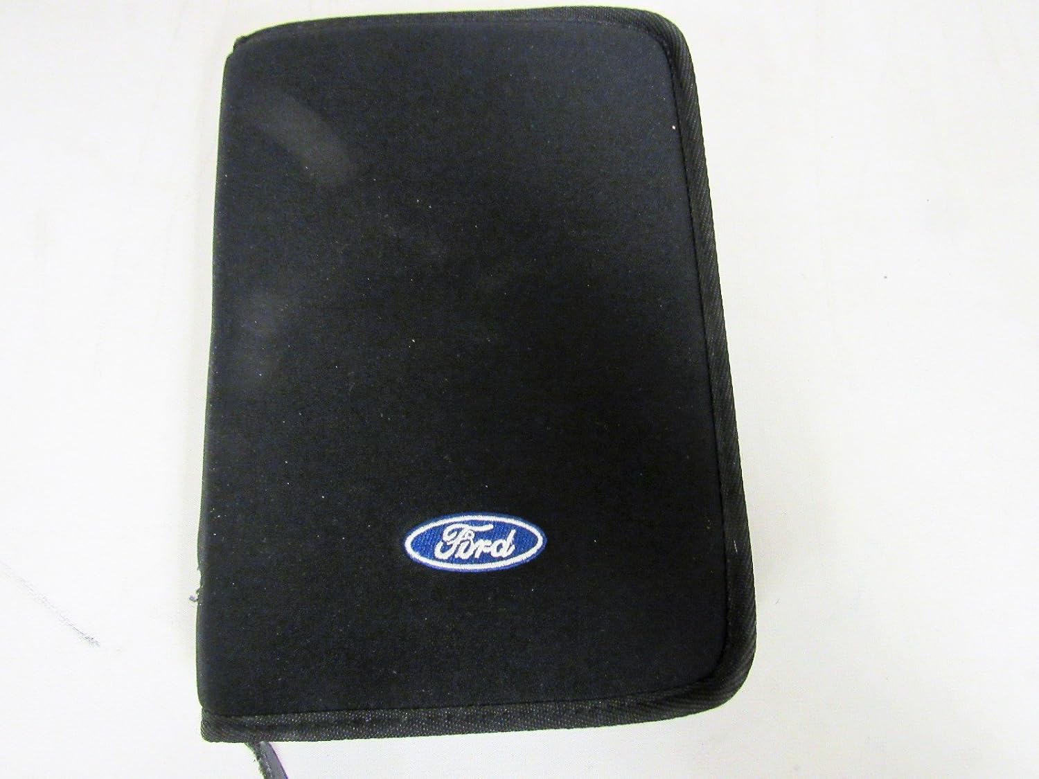 Black zippered folder with Ford logo