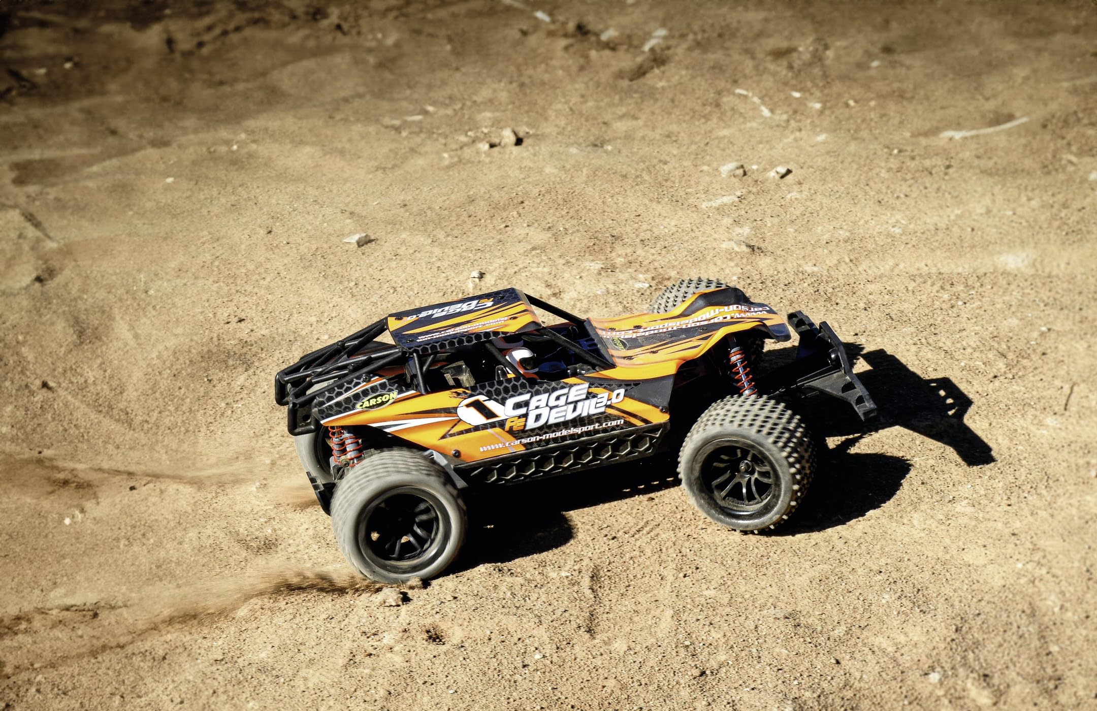 Carson 500404278 1:10 FE Cage Devil 3.0 2.4G 100% RTR - Samochód zdalnie sterowany, terenowy truggy, z bateriami i pilotem, Truggy, Pomarańczowy