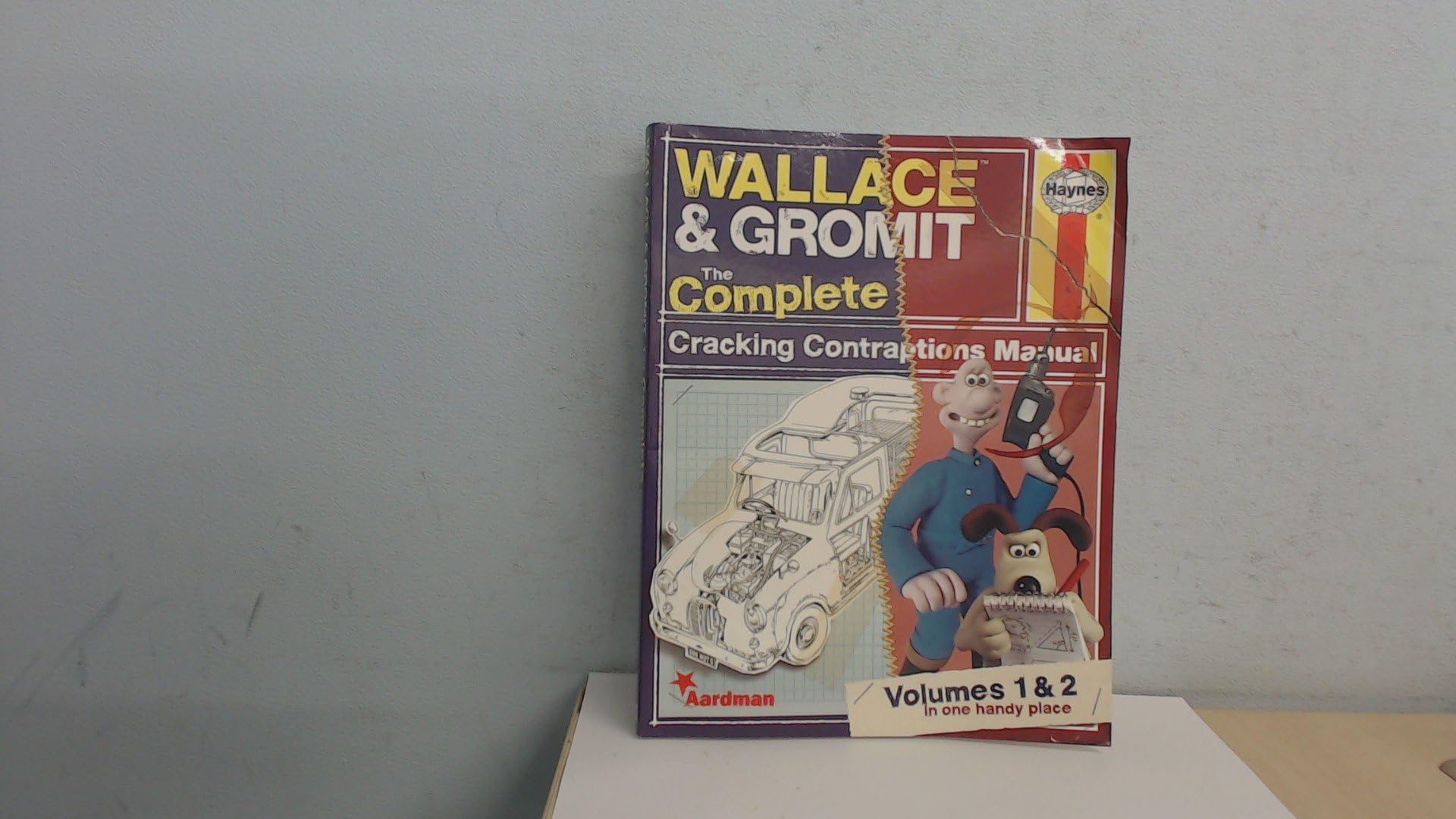 Wallace & Gromit: The Complete Cracking Contraptions Manual - Volumes 1 & 2 Paperback – Import, 1 November 2013