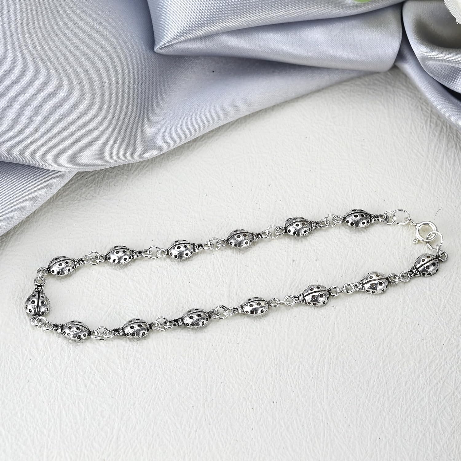 AeraVida Charming Ladybug Sterling Silver Link Bracelet | .925 Silver Lucky Ladybug Symbol Jewelry | Shiny Oxidized Animal Bracelet for Women | Linked Ladybug Design with Spring Ring Clasp | Handmade Good Fortune Accessory
