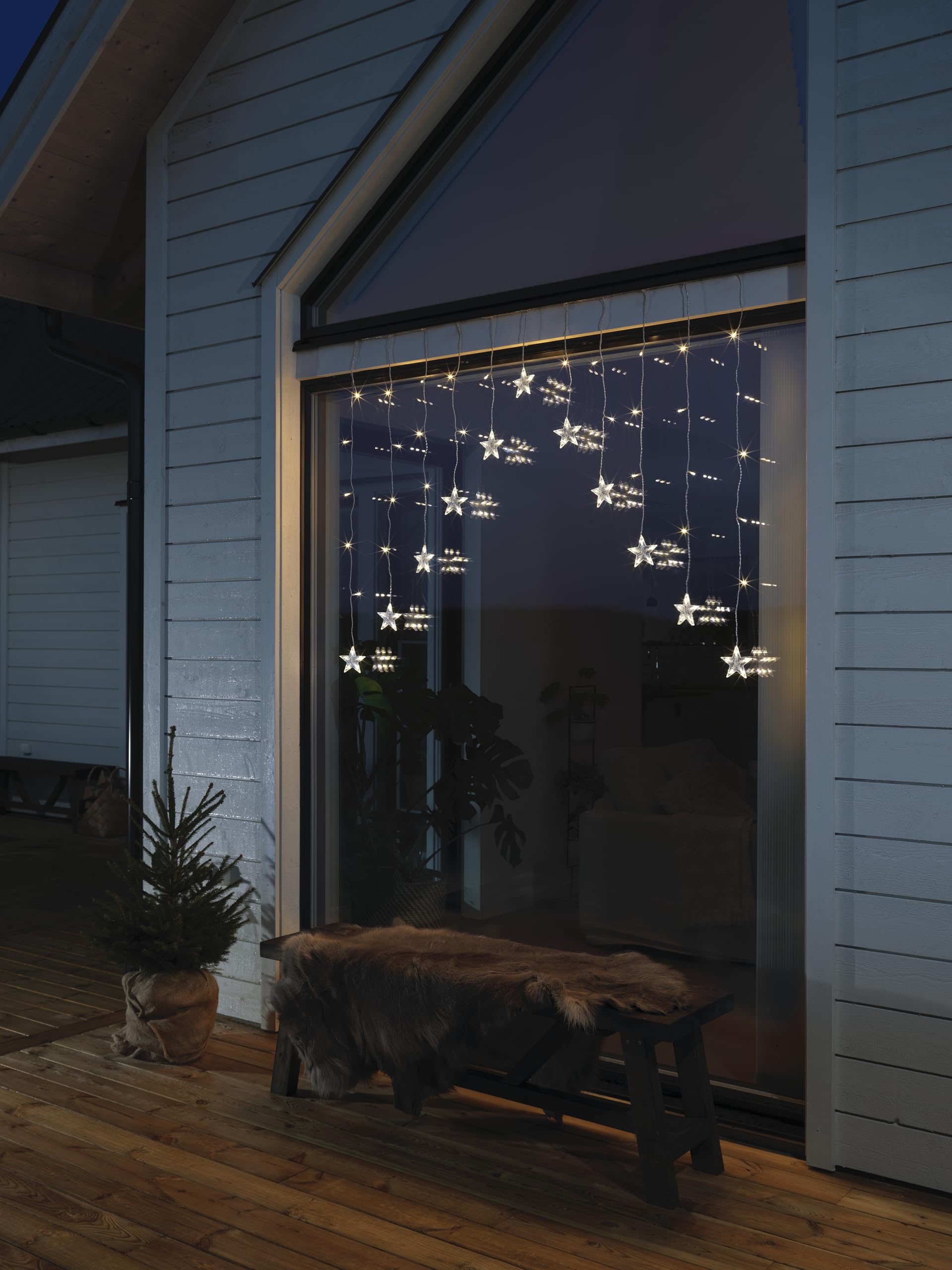 Konstsmide LED Lichtervorhang, 12 klare Sterne, 85 warm weiße Dioden, 4,5V, Außen (IP44), transparentes Kabel - 4047-103