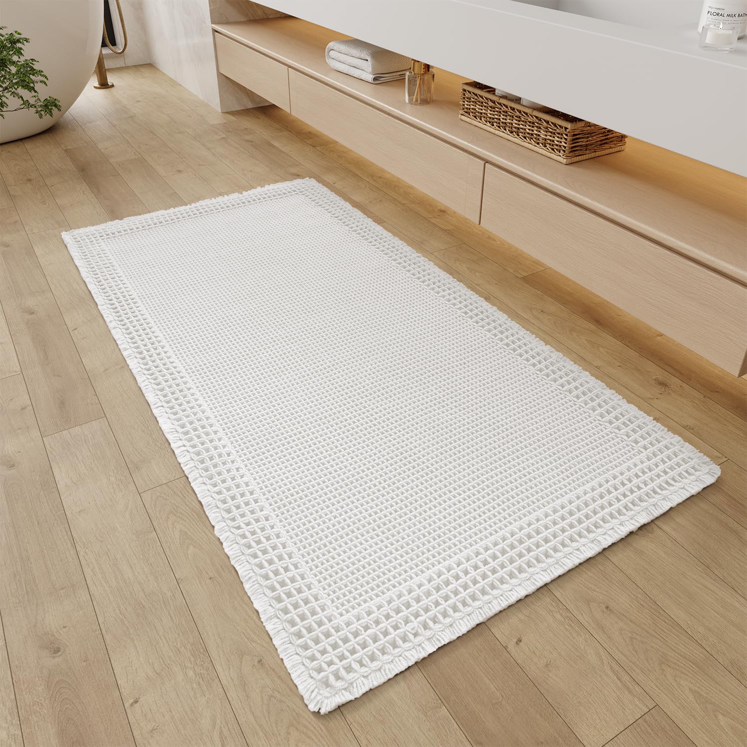 Photo 1 of RESARE Waffle Bathroom Runner Rugs, Super Absorbent Bath Mat Non Slip Washable Quick Dry, Ultra Soft Quick Dry Boho Bath Rugs with Tassels for Hallway Bedroom Laundry Room, 2'x4'(24"x48"), White