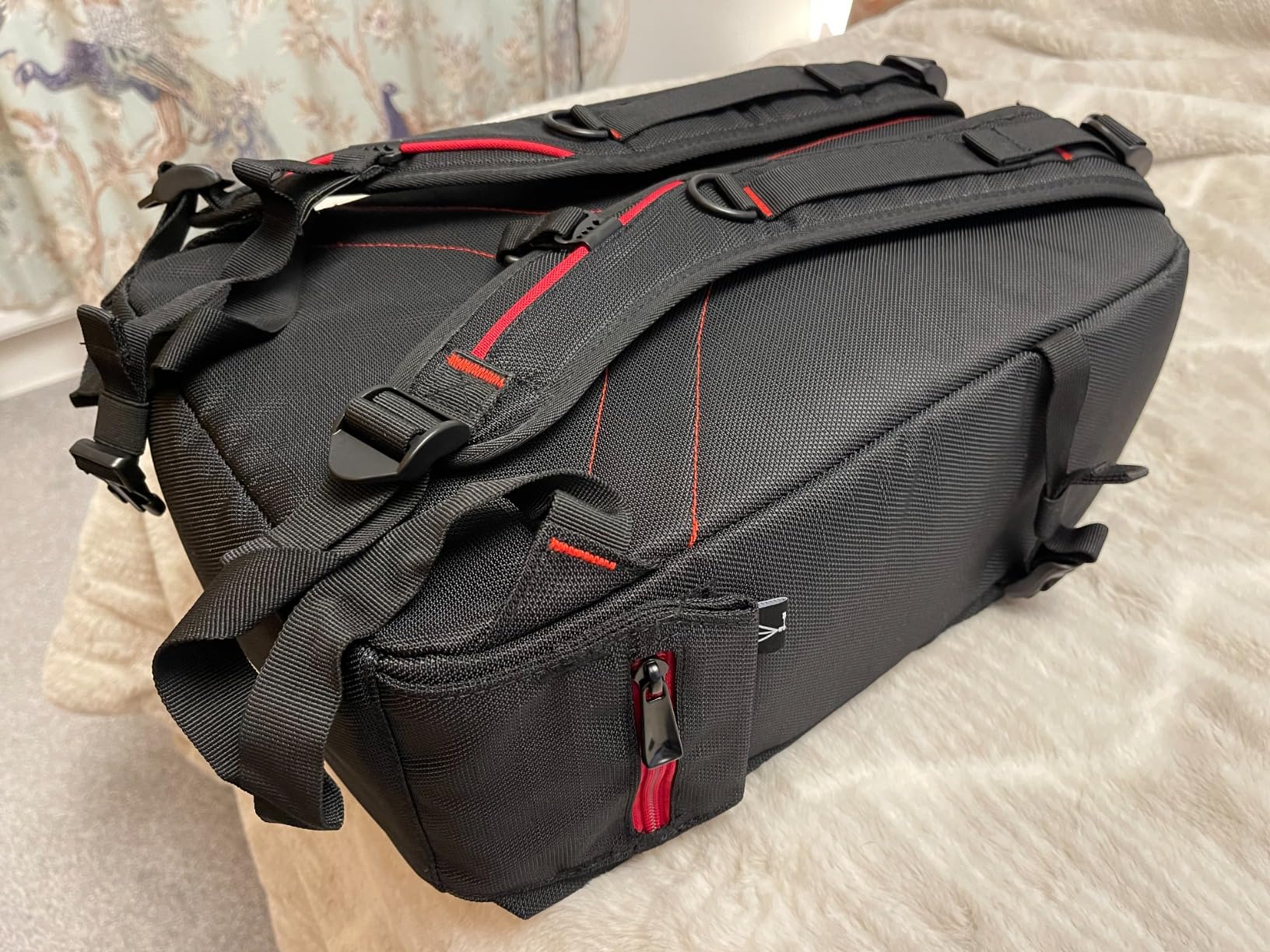 Decent size backpack for a DSLR with several lens and flash