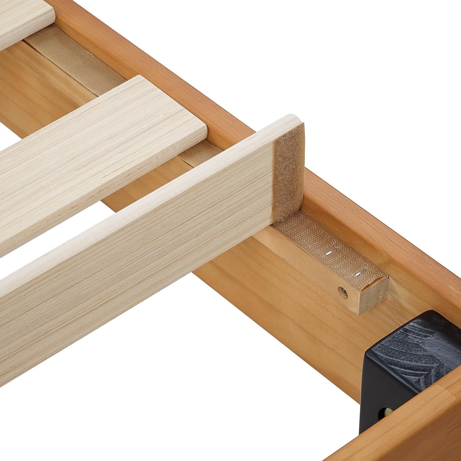 Close-up of a wooden slat secured to the bed frame, demonstrating the attachment method