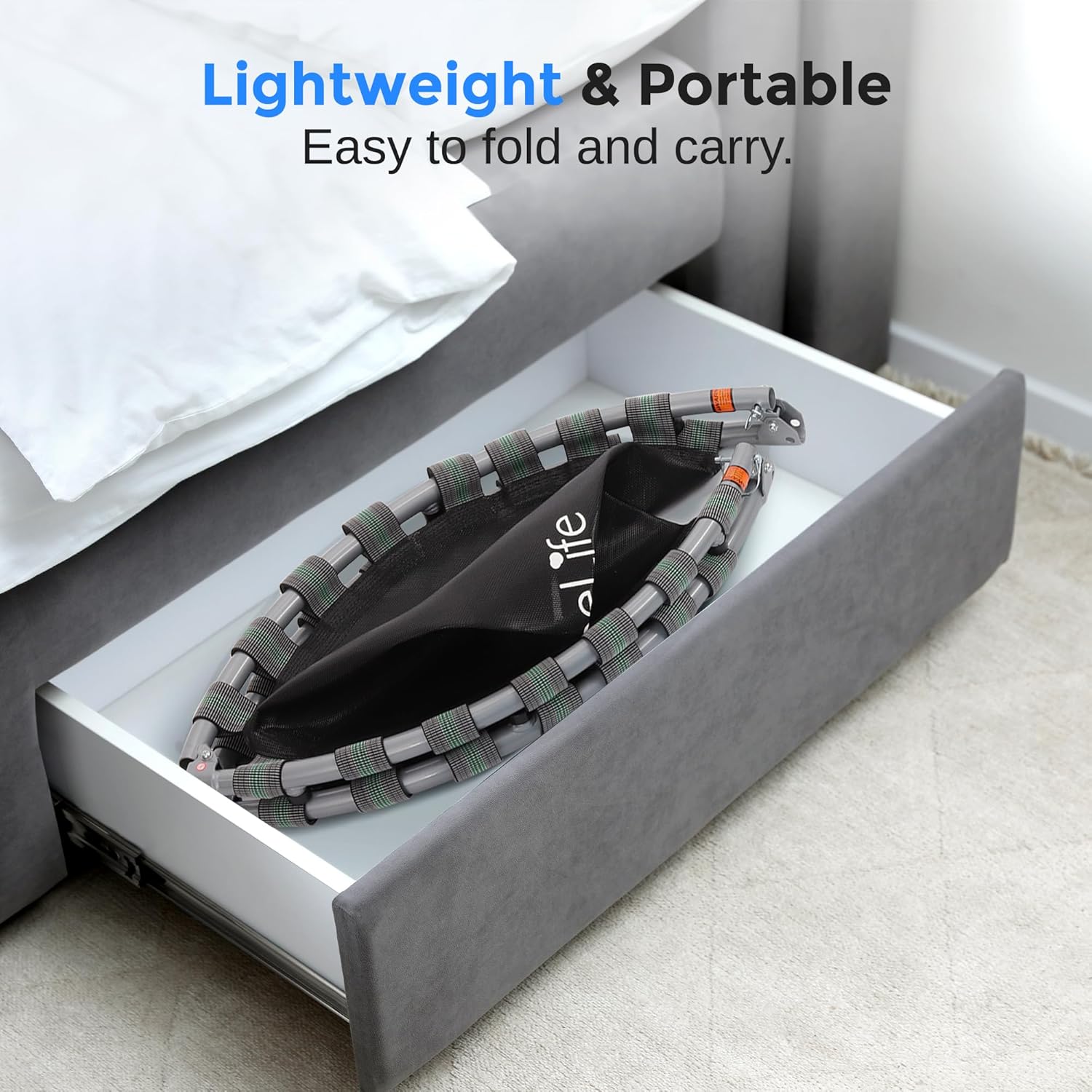 The SereneLife SLELT403 trampoline folded and stored in a drawer under a bed, demonstrating its lightweight and portable design.