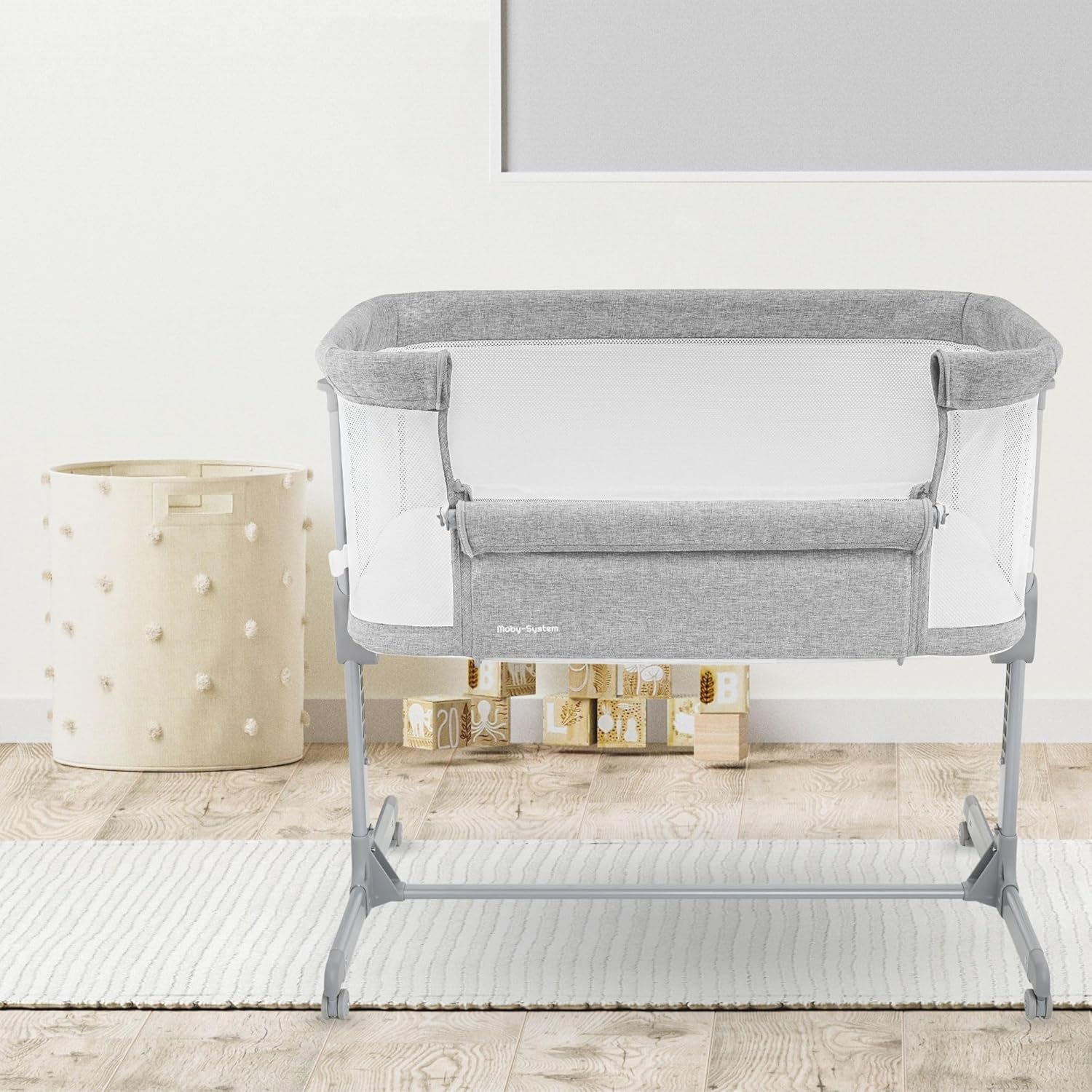 Moby-System LUNA bassinet assembled in a bedroom next to an adult bed