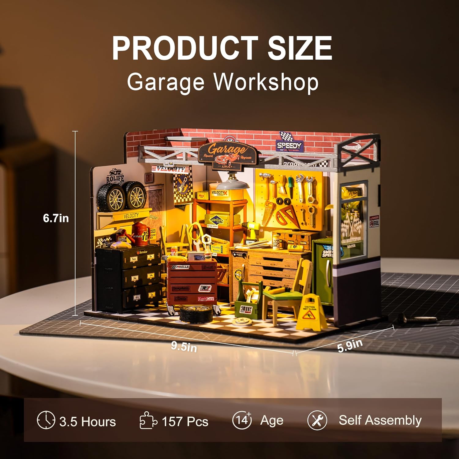 Diagram showing the dimensions of the assembled Garage Workshop: 9.5 inches wide, 5.9 inches deep, and 6.7 inches high. Icons indicate approximately 3.5 hours assembly time, 157 pieces, age 14+, and self-assembly required.